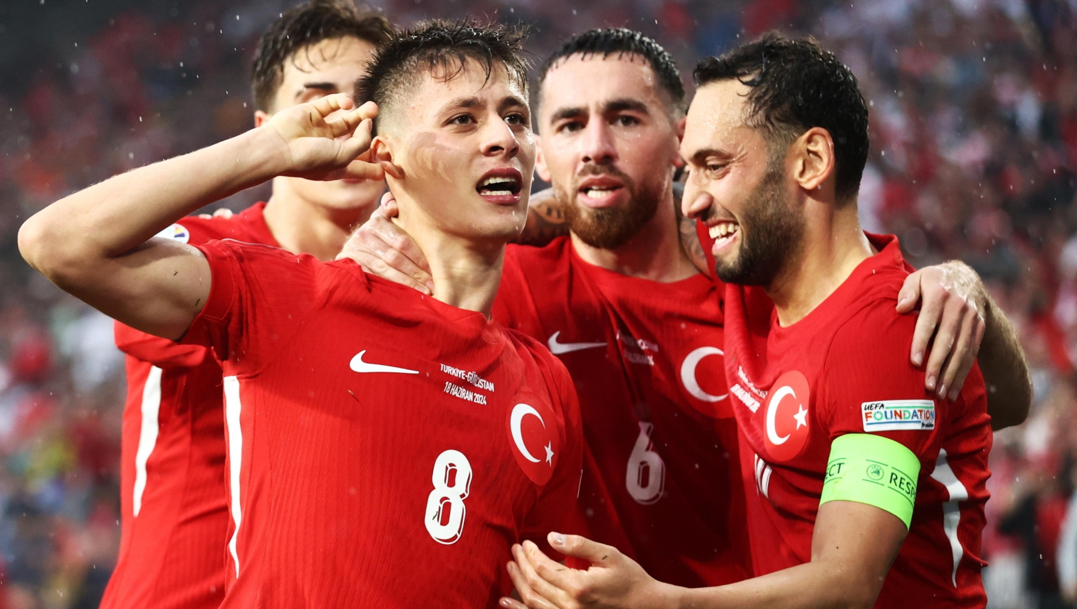epa11420567 Arda Guler (L) of Turkey celebrates with his teammates after scoring the 2-1 lead during the UEFA EURO 2024 group F soccer match between Turkey and Georgia, in Dortmund, Germany, 18 June 2024.  EPA/Leszek Szymanski POLAND OUT