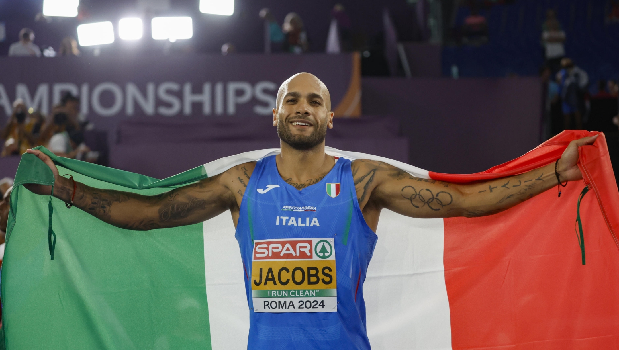 Gold medalist Marcell Jacobs of Italy celebrates after the 100m Men Final during the European Athletics Championship at Olimpico Stadium in Rome, Italy, 08 June 2024. ANSA/FABIO FRUSTACI