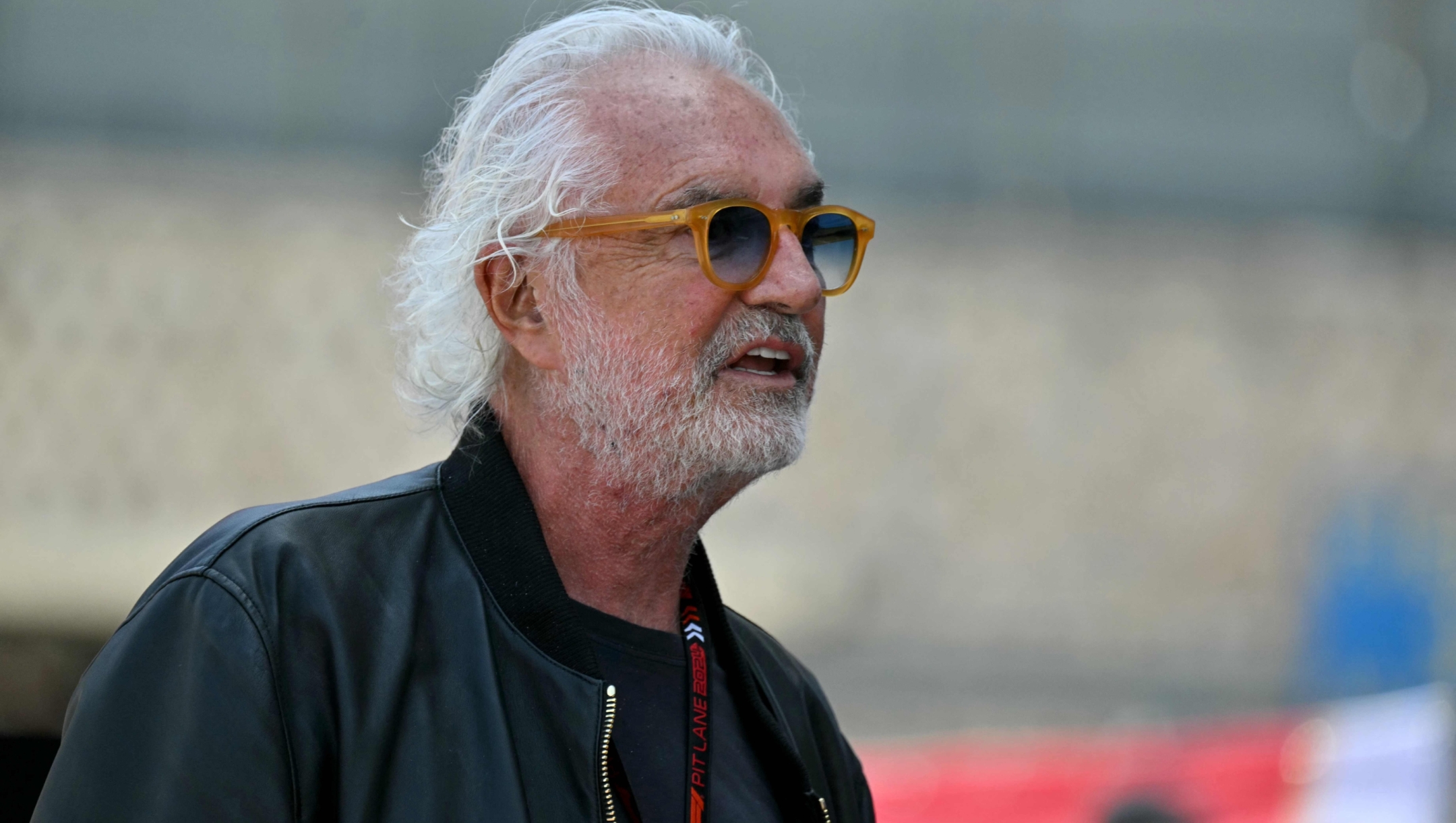(FILES) Driver manager Flavio Briatore walks in the pit lane of the Circuit de Monaco ahead of the Formula One Monaco Grand Prix on May 26, 2024. Italian Flavio Briatore, former boss of the Benetton and Renault teams in the 1990s and 2000s, has been appointed "executive advisor" by Alpine, the Franco-British Formula 1 team said on June 21 in a press release. "Briatore will focus primarily on the team's high-level activities, including: the search for top talent and analysis of the driver market, challenging the existing project by evaluating the current structure and advising on certain strategic issues in the sport," Alpine details. (Photo by ANDREJ ISAKOVIC / AFP)