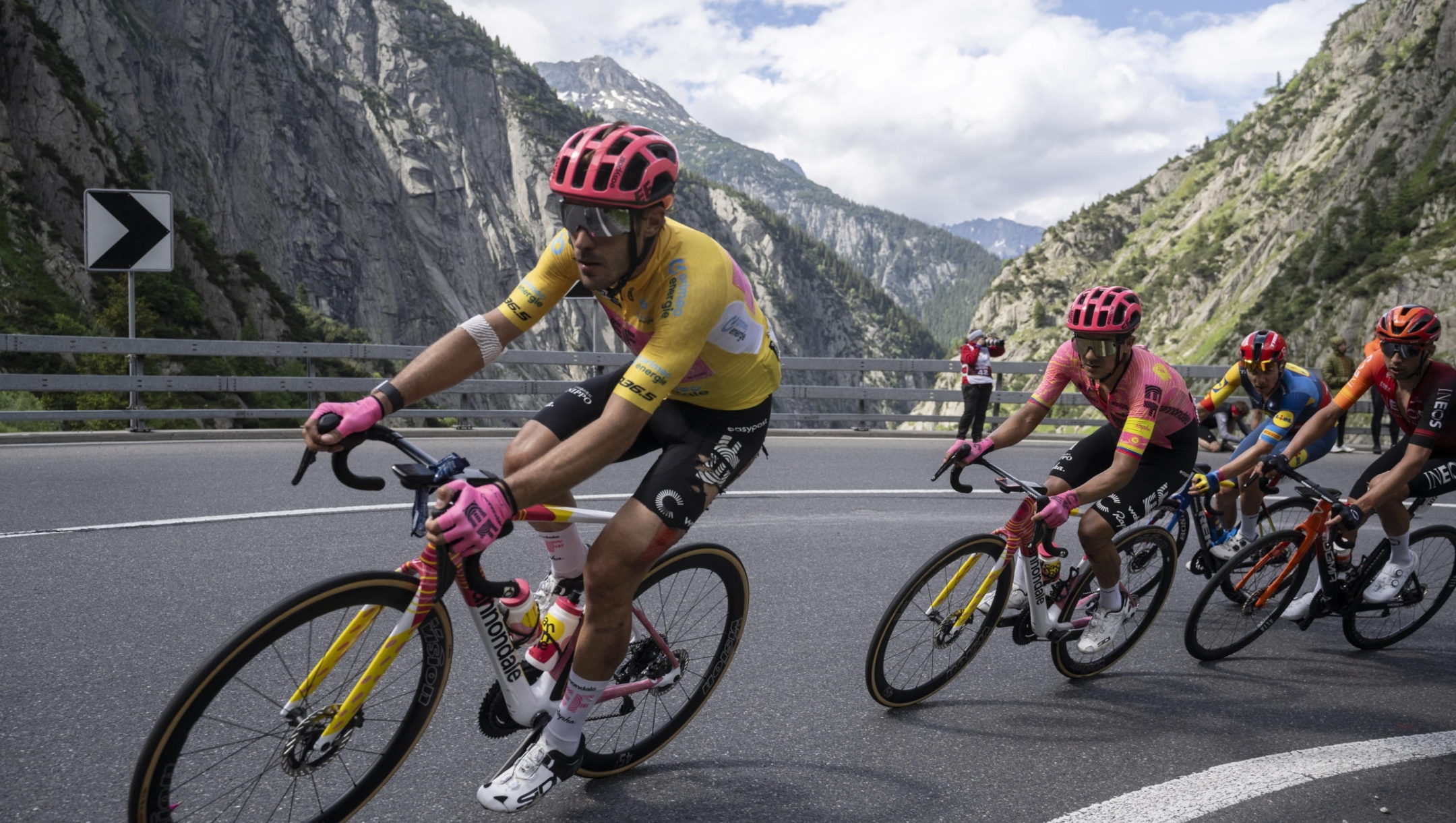 epa11406060 Alberto Bettiol (L) from Italy of EF Education Easy Post and Richard Carapaz (R) from Ecuador of EF Education Easy Post climb with the pack in the Schoellenen canyon as it competes in the Tour de Suisse's fourth stage, a 170.9km cycling race from Rueschlikon to San Gottardo, Switzerland, 12 June 2024.  EPA/GIAN EHRENZELLER