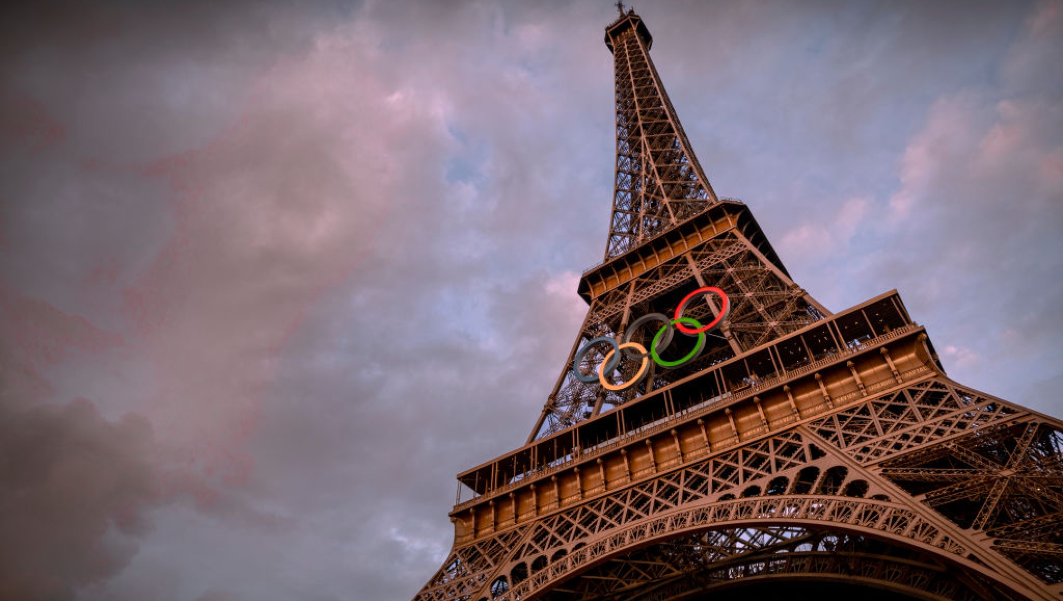 PARIS, FRANCE - JUNE 12: The Olympic rings are seen on the Eiffel Tower ahead of the start of the Paris 2024 Olympic Games on June 12, 2024 in Paris, France. The 2024 Summer Olympic Games begin on July 26. (Photo by Kiran Ridley/Getty Images)