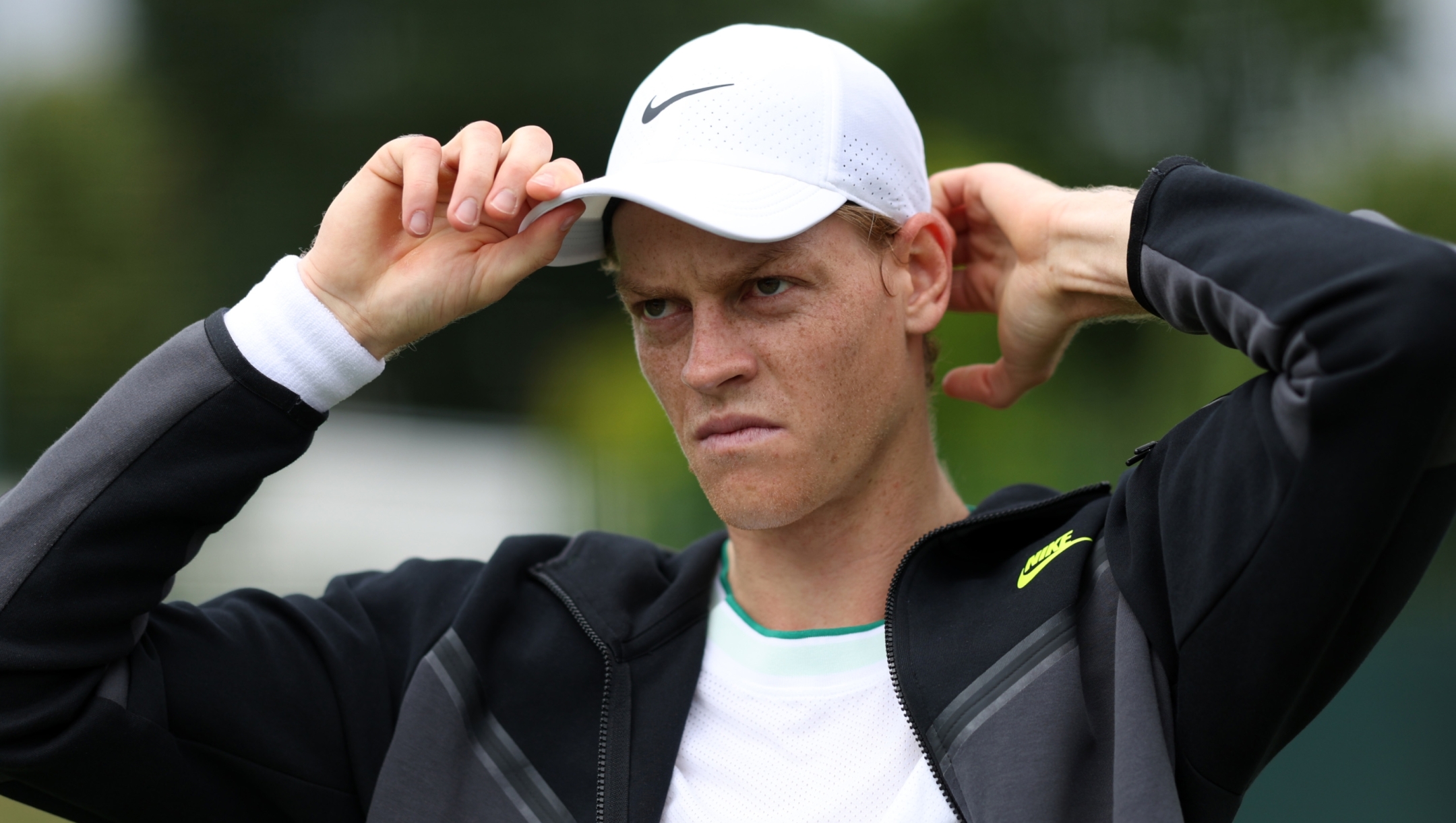 LONDON, ENGLAND - JUNE 28: Jannik Sinner of Italy adjusts his cap following practice prior to The Championships Wimbledon 2024 at All England Lawn Tennis and Croquet Club on June 28, 2024 in London, England. (Photo by Clive Brunskill/Getty Images)