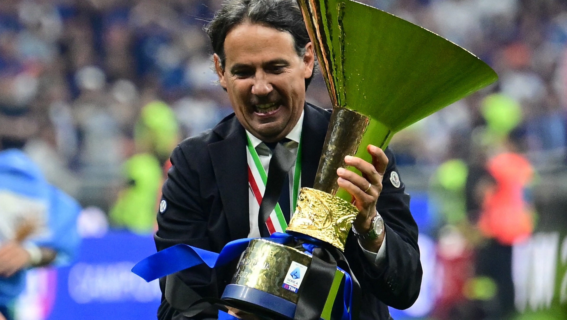 Inter Milan's Italian coach Simone Inzaghi holds the trophy during the ceremony for the Italian Champions following the Italian Serie A football match between Inter Milan and Lazio in Milan, on May 19, 2024. Inter celebrates his 20th Scudetto. (Photo by Marco BERTORELLO / AFP)