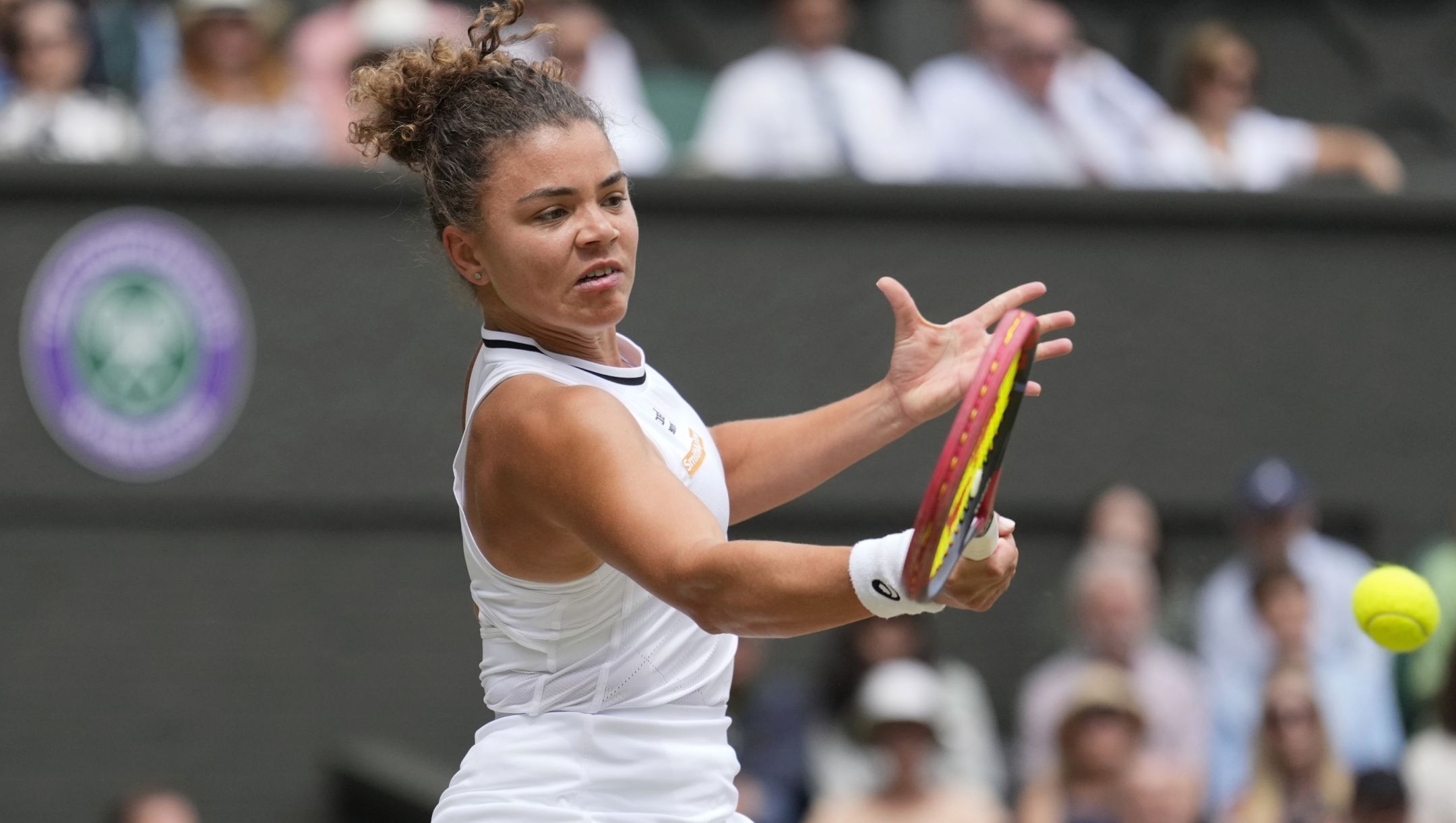 Jasmine Paolini of Italy plays a forehand return to Barbora Krejcikova of the Czech Republic during the women's singles final at the Wimbledon tennis championships in London, Saturday, July 13, 2024. (AP Photo/Mosa'ab Elshamy)