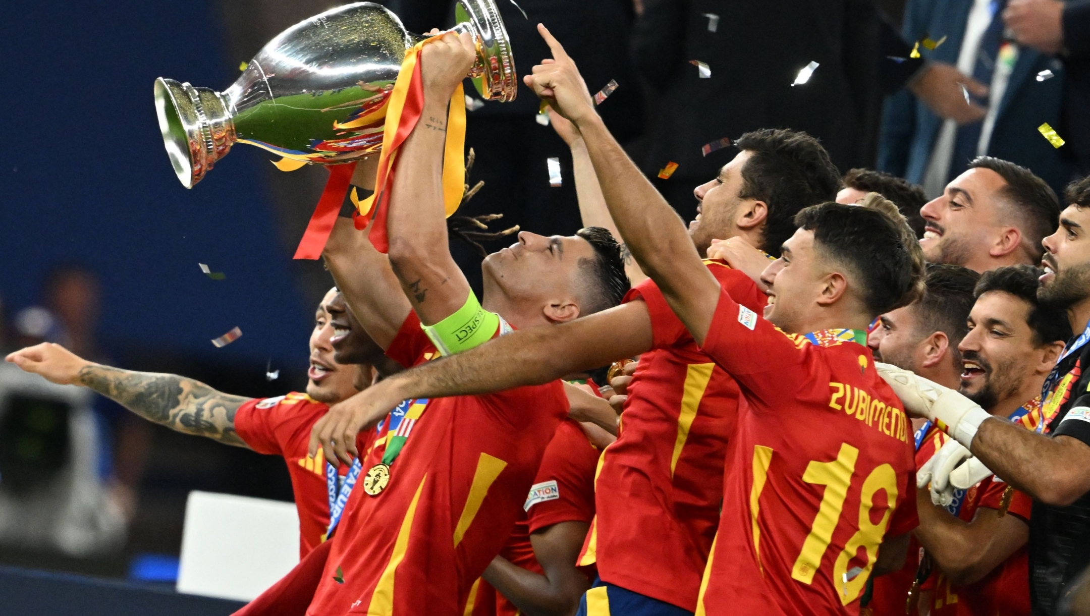 Spain's forward #07 Alvaro Morata (C) rises the trophy after winning the UEFA Euro 2024 final football match between Spain and England at the Olympiastadion in Berlin on July 14, 2024. (Photo by INA FASSBENDER / AFP)