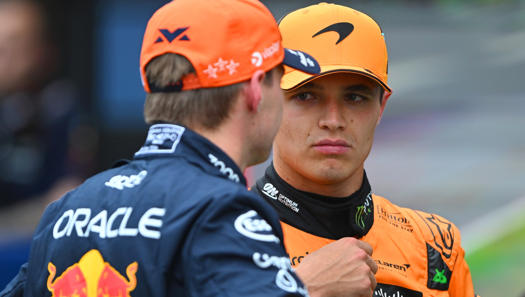 BUDAPEST, HUNGARY - JULY 20: Pole position qualifier Lando Norris of Great Britain and McLaren and Third placed qualifier Max Verstappen of the Netherlands and Oracle Red Bull Racing talk in parc ferme during qualifying ahead of the F1 Grand Prix of Hungary at Hungaroring on July 20, 2024 in Budapest, Hungary. (Photo by Rudy Carezzevoli/Getty Images)