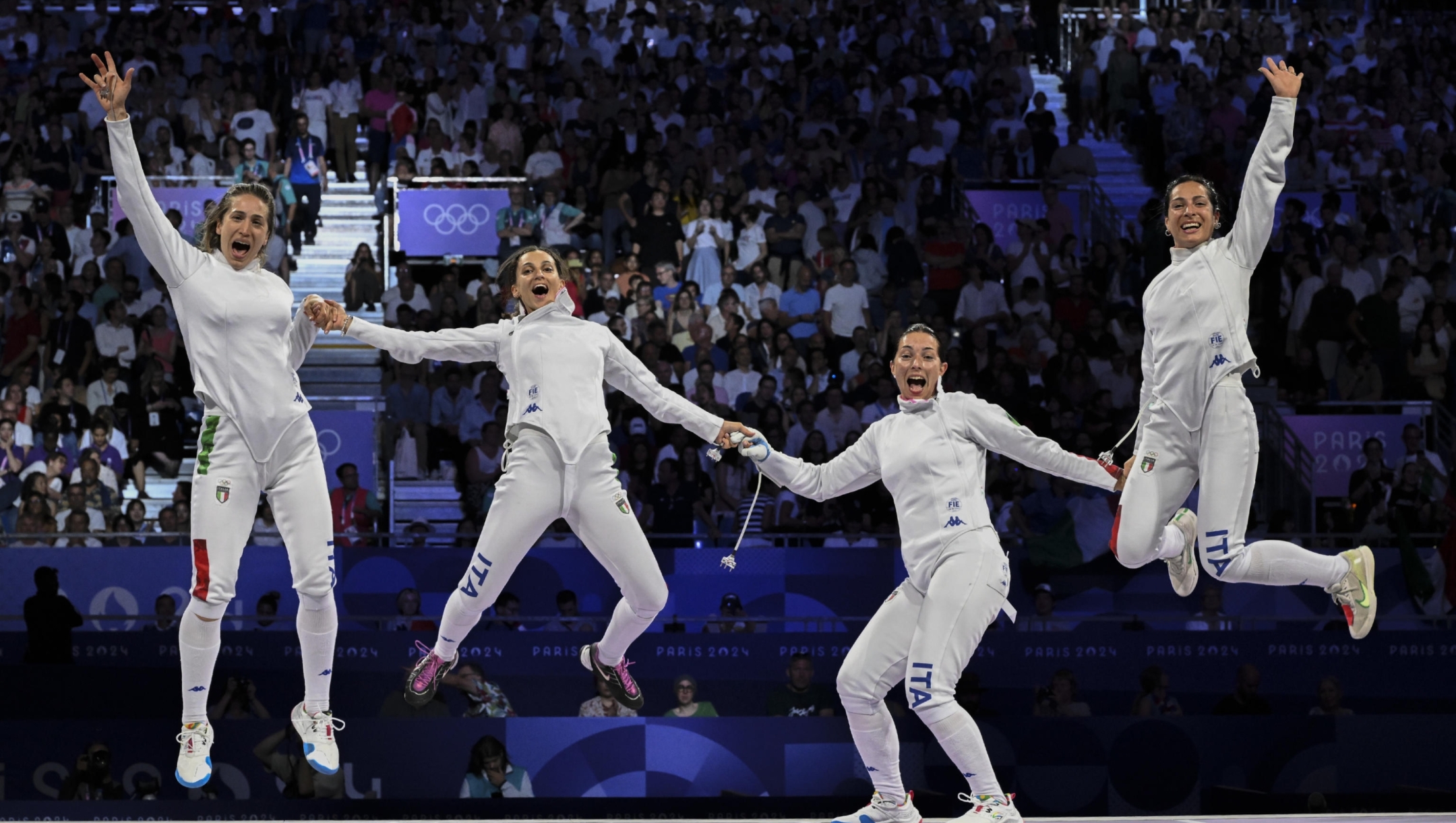 (L-R) Gulia Rizzi, Rossella Fiamingo, Alberta Santuccio and Mara Navarria     gold medalist Italy epee team celebrates during award ceremony for the Women Epee Team Gold medal match bout of the Fencing competitions in the Paris 2024 Olympic Games, at the Grand Palais in Paris, France, 30 July 2024. ANSA / CIRO FUSCO