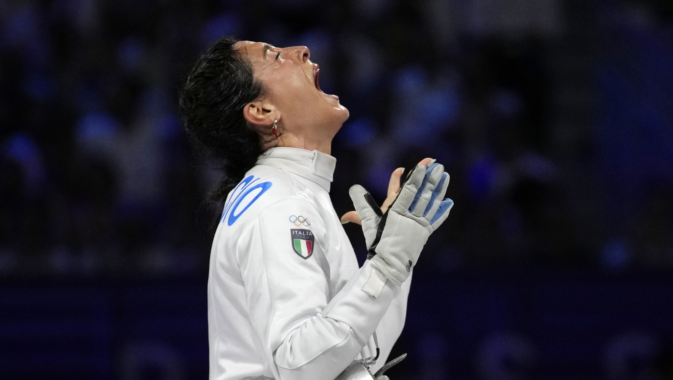 Italy's Alberta Santuccio celebrates after winning the women's team Epee final match against France during the 2024 Summer Olympics at the Grand Palais, Tuesday, July 30, 2024, in Paris, France. (AP Photo/Andrew Medichini)