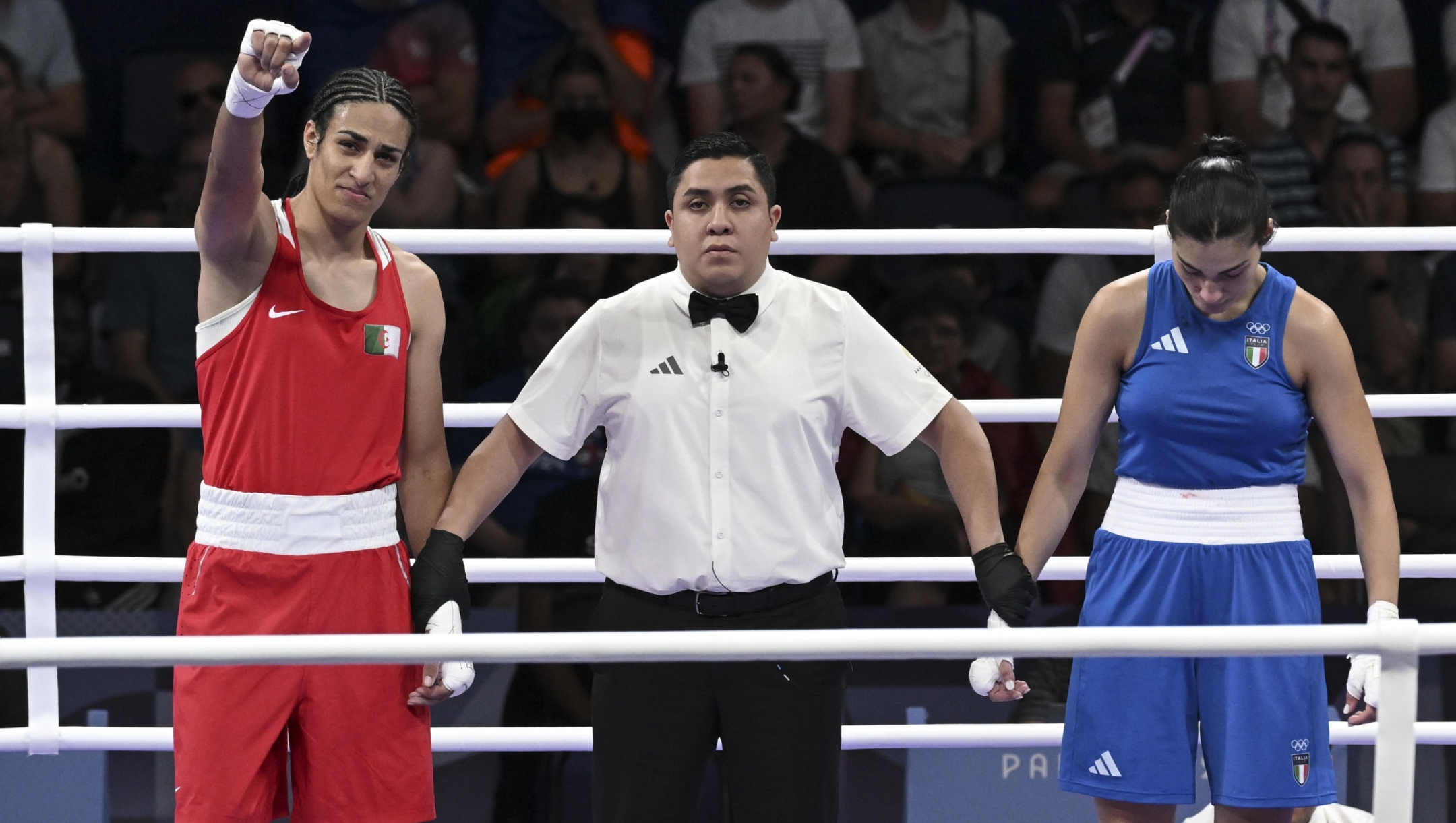 Imane Khelif  of Algeria  ( Red) Angela Carini  of Italy ( Bleu) in action during their women's 66kg preliminar round of 16 bout of the Boxing competitions in the Paris 2024 Olympic Games, at the North Paris Arena in Villepinte, France,  1 August 2024 . ANSA / CIRO FUSCO