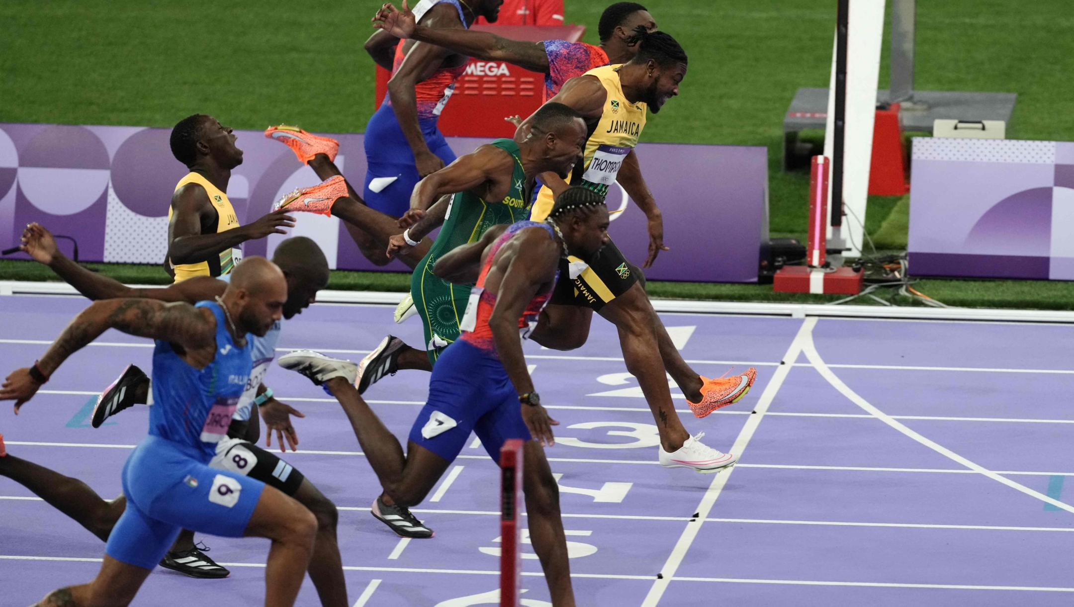 (Bottom to top) Italy's Lamont Marcell Jacobs, Botswana's Letsile Tebogo, US' Noah Lyles, Jamaica's Oblique Seville, South Africa's Akani Simbine, Jamaica's Kishane Thompson, US' Fred Kerley amd US' Kenneth Bednarek compete in the men's 100m final of the athletics event at the Paris 2024 Olympic Games at Stade de France in Saint-Denis, north of Paris, on August 4, 2024. (Photo by Dimitar DILKOFF / AFP)