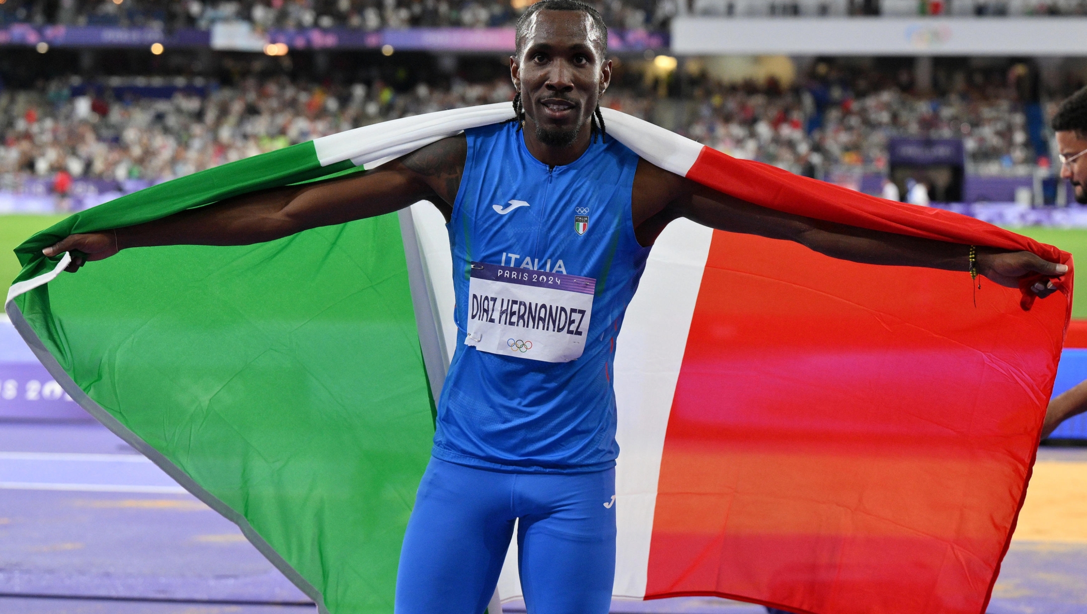 Italy's Andy Diaz Hernandez celebrates after winning the bronze medal in the men's triple jump final of the of the Athletics competitions in the Paris 2024 Olympic Games, at the Stade de France stadium in Saint Denis, France, 09 August 2024 ANSA/ETTORE FERRARI