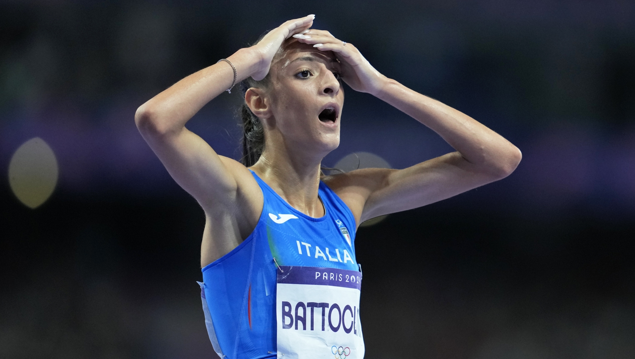 Nadia Battocletti, of Italy, reacts after winning the silver medal in the women's 10000 meters final at the 2024 Summer Olympics, Friday, Aug. 9, 2024, in Saint-Denis, France. (AP Photo/Ashley Landis)