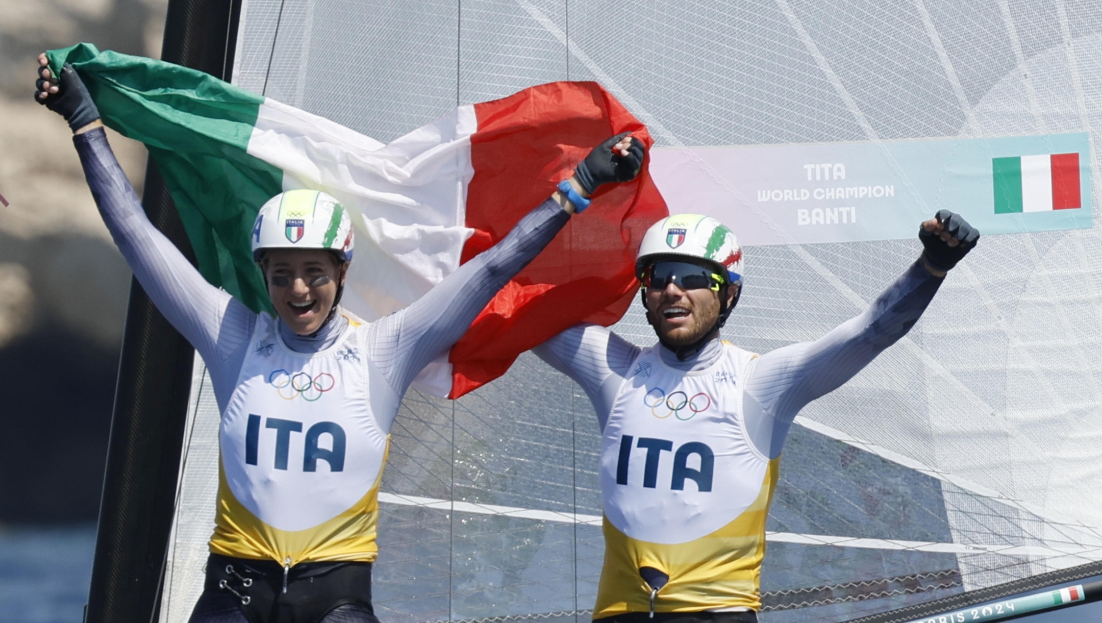 epa11536173 Ruggero Tita and Caterina Marianna Banti of Italy celebrate after the Mixed Multihull medal race of the Sailing competitions in the Paris 2024 Olympic Games, at the Marseille Marina in Marseille, France, 08 August 2024.  EPA/Sebastien Nogier