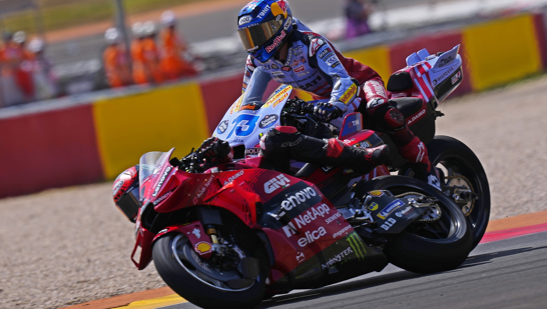 Spain's rider Alex Marquez of the Gresini Racing MotoGP, right and Italian rider Francesco Bagnaia of the Ducati Lenovo Team collide during the MotoGP race at the Aragon Motorcycle Grand Prix at the MotorLand Aragon circuit, in Alcaniz, Spain, Sunday, Sept. 1, 2024. (AP Photo/Jose Breton)