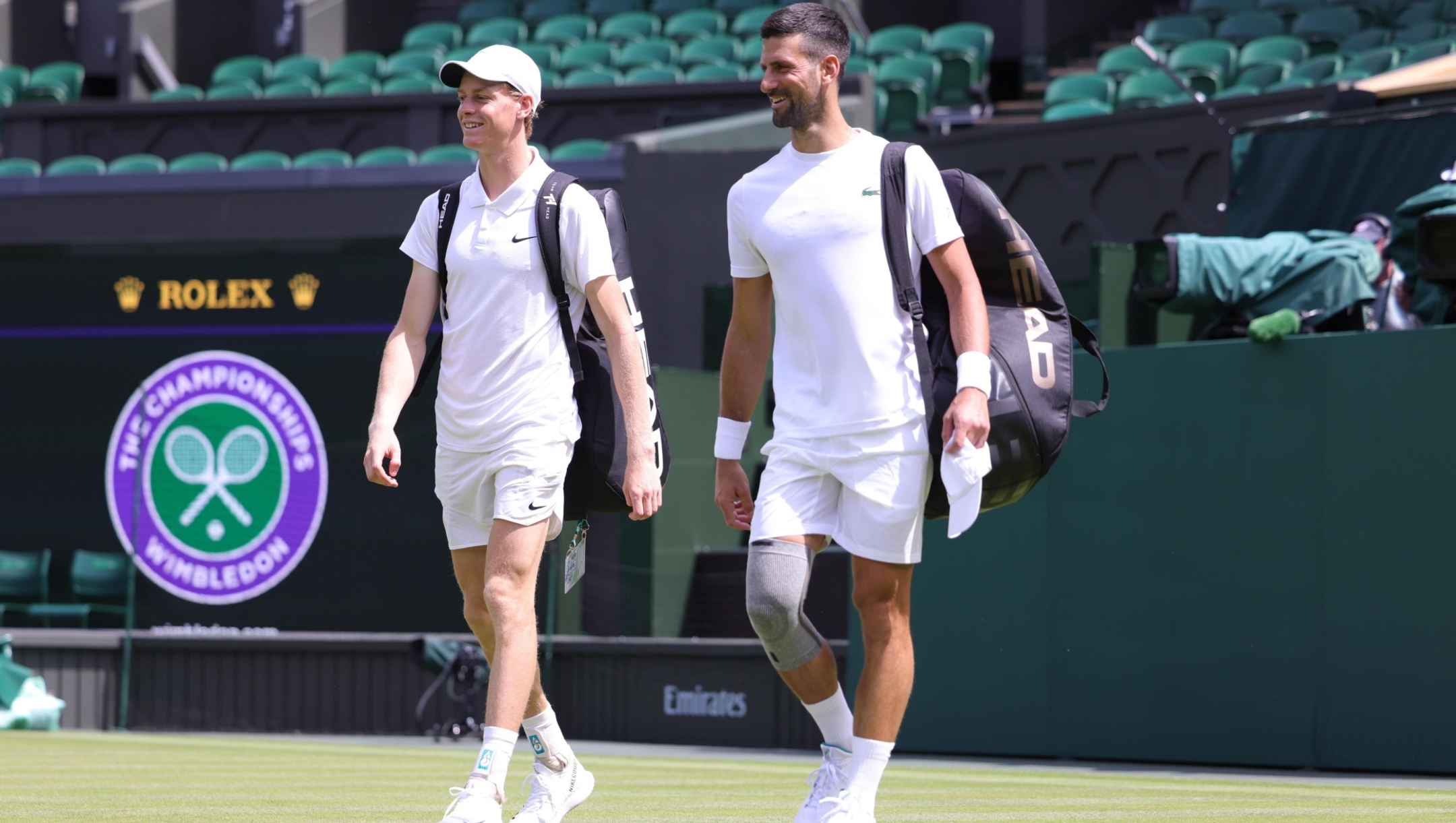 epa11441619 Jannik Sinner of Italy (L) and Novak Djokovic of Serbia (R) take part in a practice session on Centre Court ahead of the Wimbledon tennis championships at the AELTC at Wimbledon, London, Britain, 27 June 2024.  EPA/NEIL HALL