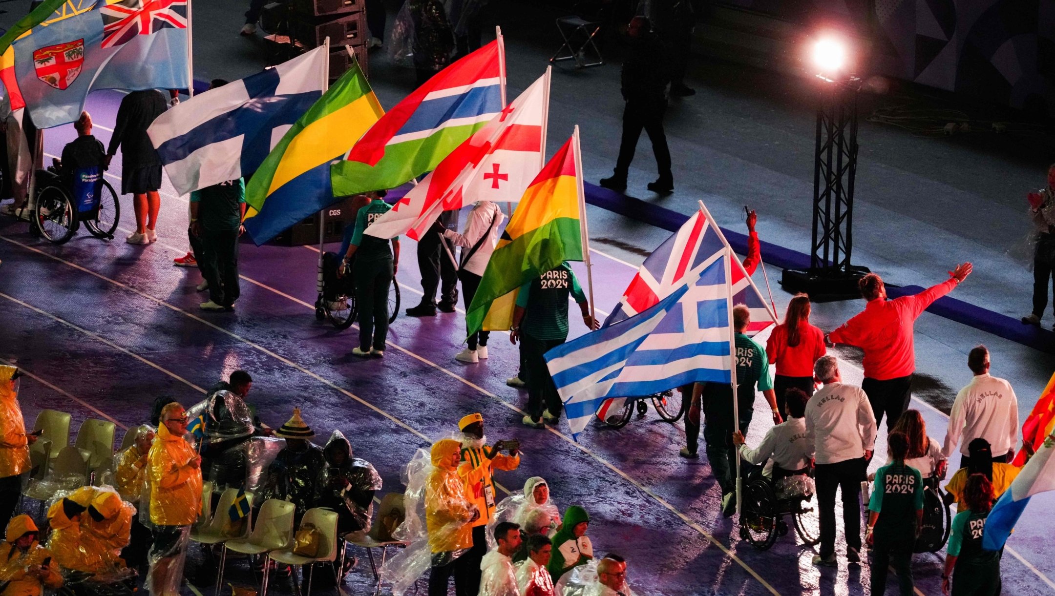 Delegations parade during the Paris 2024 Paralympic Games Closing Ceremony at the Stade de France, in Saint-Denis, in the outskirts of Paris, on September 8, 2024. (Photo by Dimitar DILKOFF / AFP)