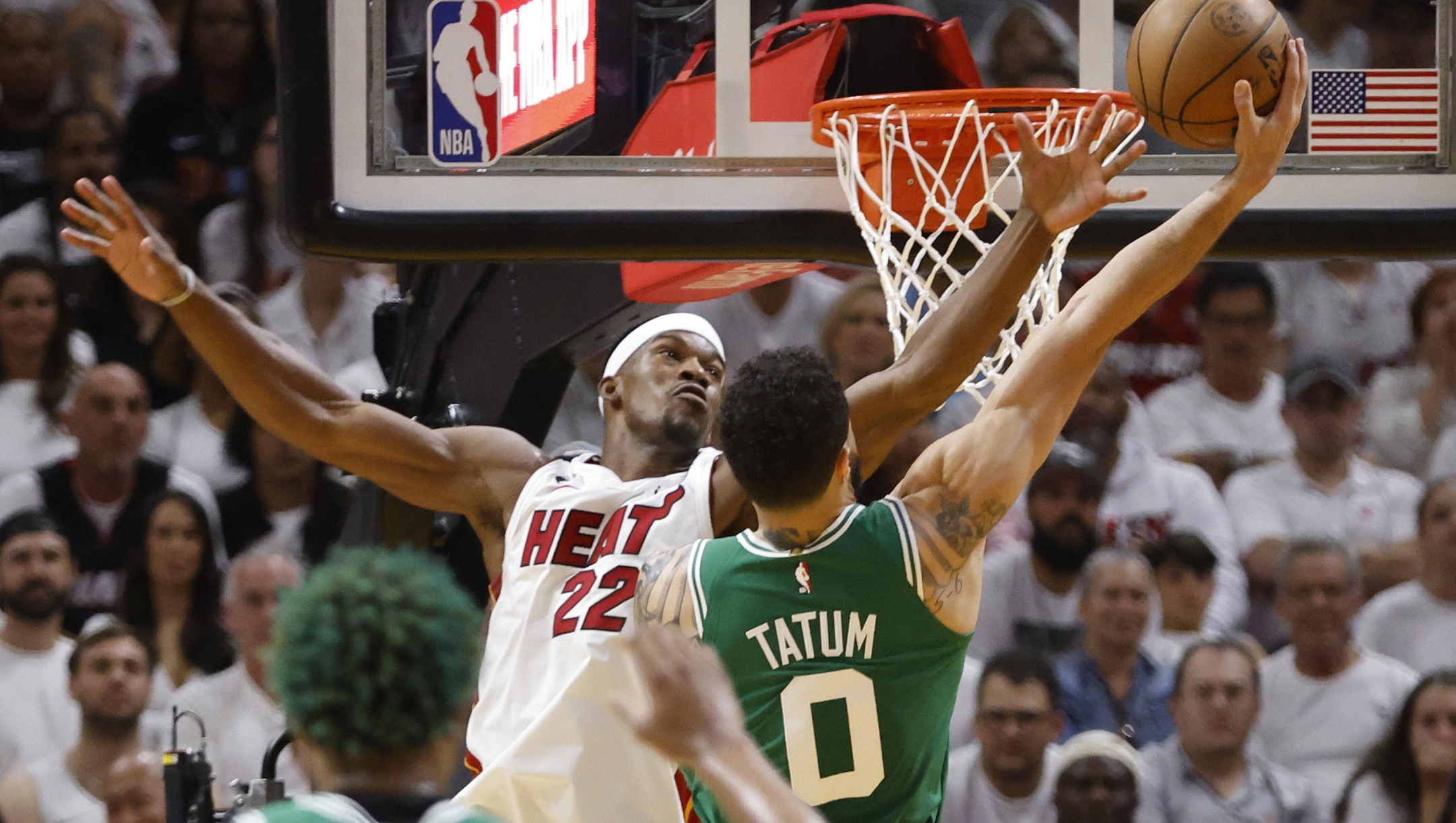 epa10649176 Boston Celtics forward Jayson Tatum (R) shoots around Miami Heat forward Jimmy Butler (L) during the second half of the NBA basketball Eastern Conference Finals playoff game four between the Miami Heat and the Boston Celtics at the Kaseya Center in Miami, Florida, USA, 23 May 2023.  EPA/RHONA WISE  SHUTTERSTOCK OUT