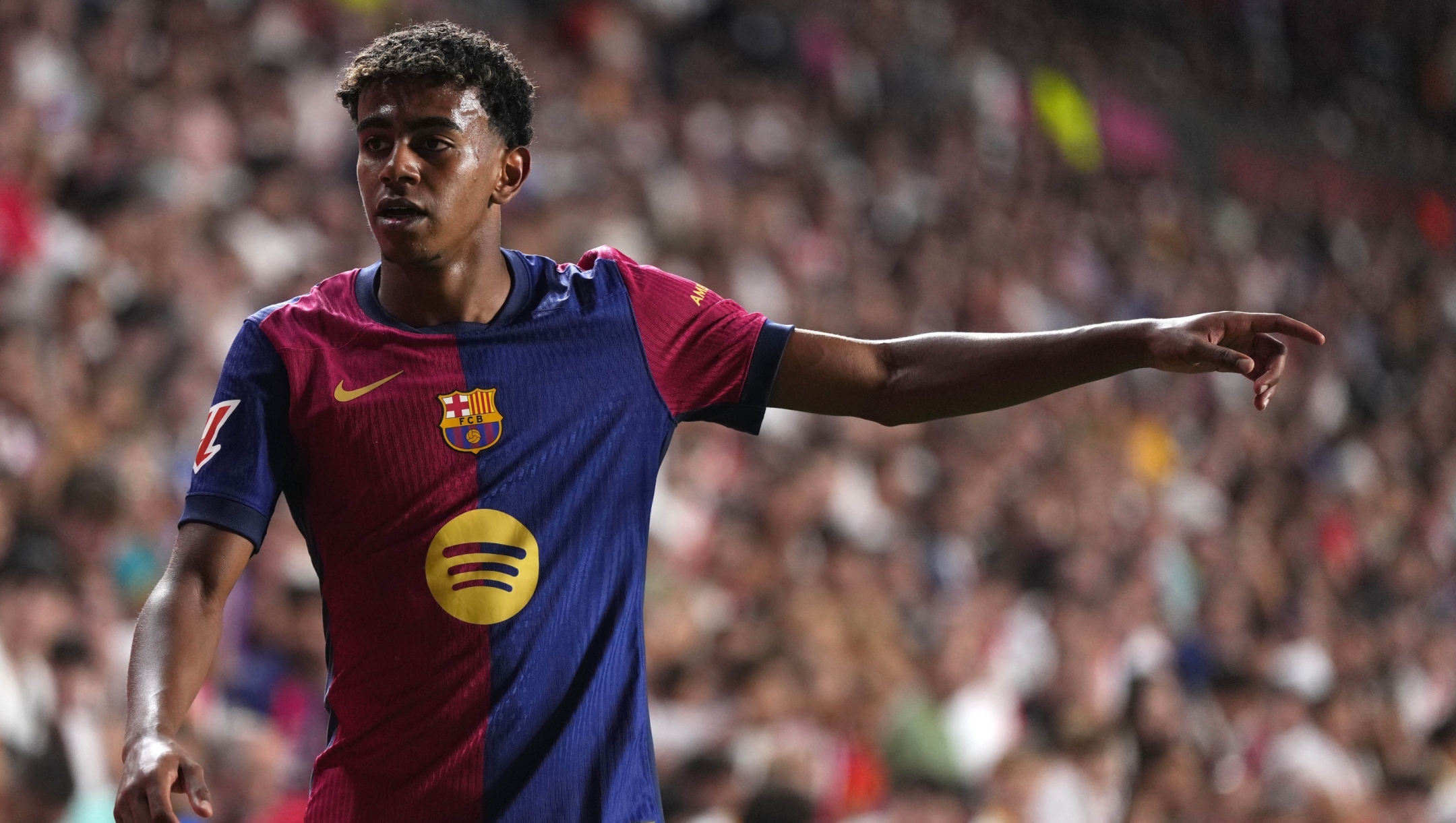 Barcelona's Lamine Yamal reacts during the Spanish La Liga soccer match between Rayo Vallecano and Barcelona at the Vallecas stadium in Madrid, Spain, Tuesday, Aug. 27, 2024. (AP Photo/Manu Fernandez)