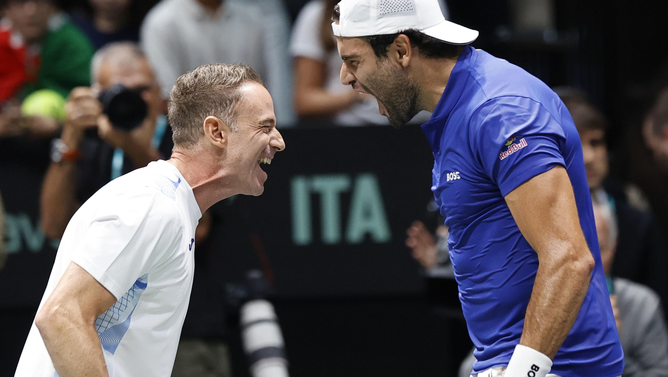 Italian tennis player  Matteo Berrettini  with captain team Filippo Volandri celebrates the victory against Brasilian  player Joao Fonseca  during the match of Davis Cup Final Group Stage at Unipol Arena in Casalecchio (Bologna) Italy, 11 September 2024. ANSA /ELISABETTA BARACCHI