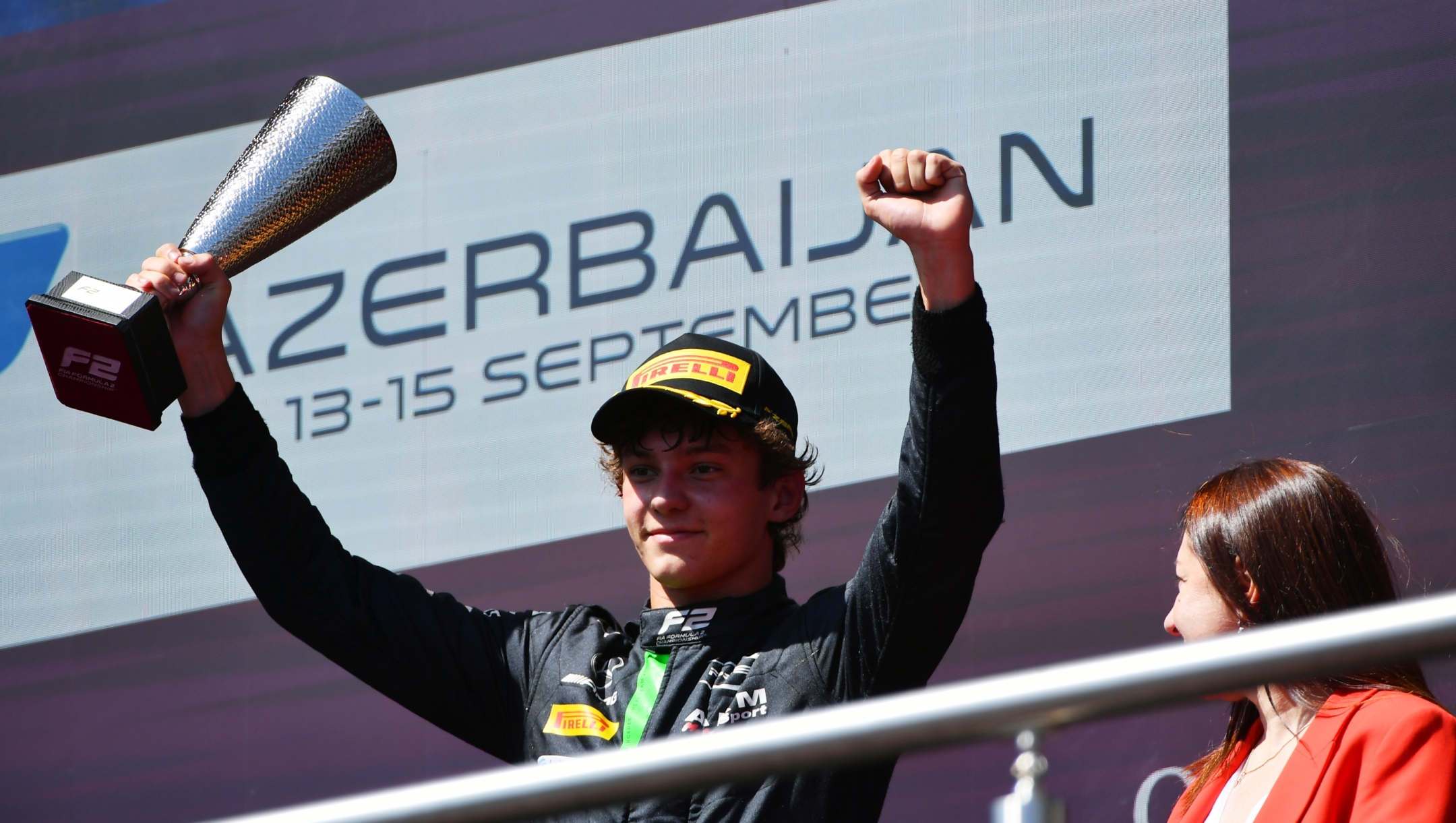 BAKU, AZERBAIJAN - SEPTEMBER 15: Third placed Andrea Kimi Antonelli of Italy and PREMA Racing (4) celebrates on the podium during the Round 12 Baku Feature race of the Formula 2 Championship at Baku City Circuit on September 15, 2024 in Baku, Azerbaijan. (Photo by James Sutton/Getty Images)