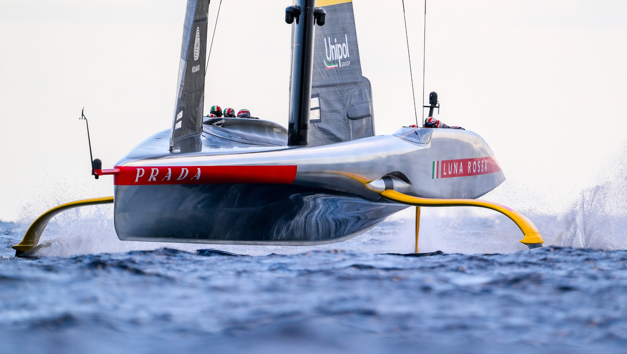 BARCELONA, SPAIN - OCTOBER 04: The AC75 Luna Rossa Prada Pirelli Team competes against The AC75 Ineos Britannia team during race 11 of the Louis Vuitton Cup Final - 37th America's Cup on October 04, 2024 in Barcelona, Spain. (Photo by David Ramos/Getty Images)