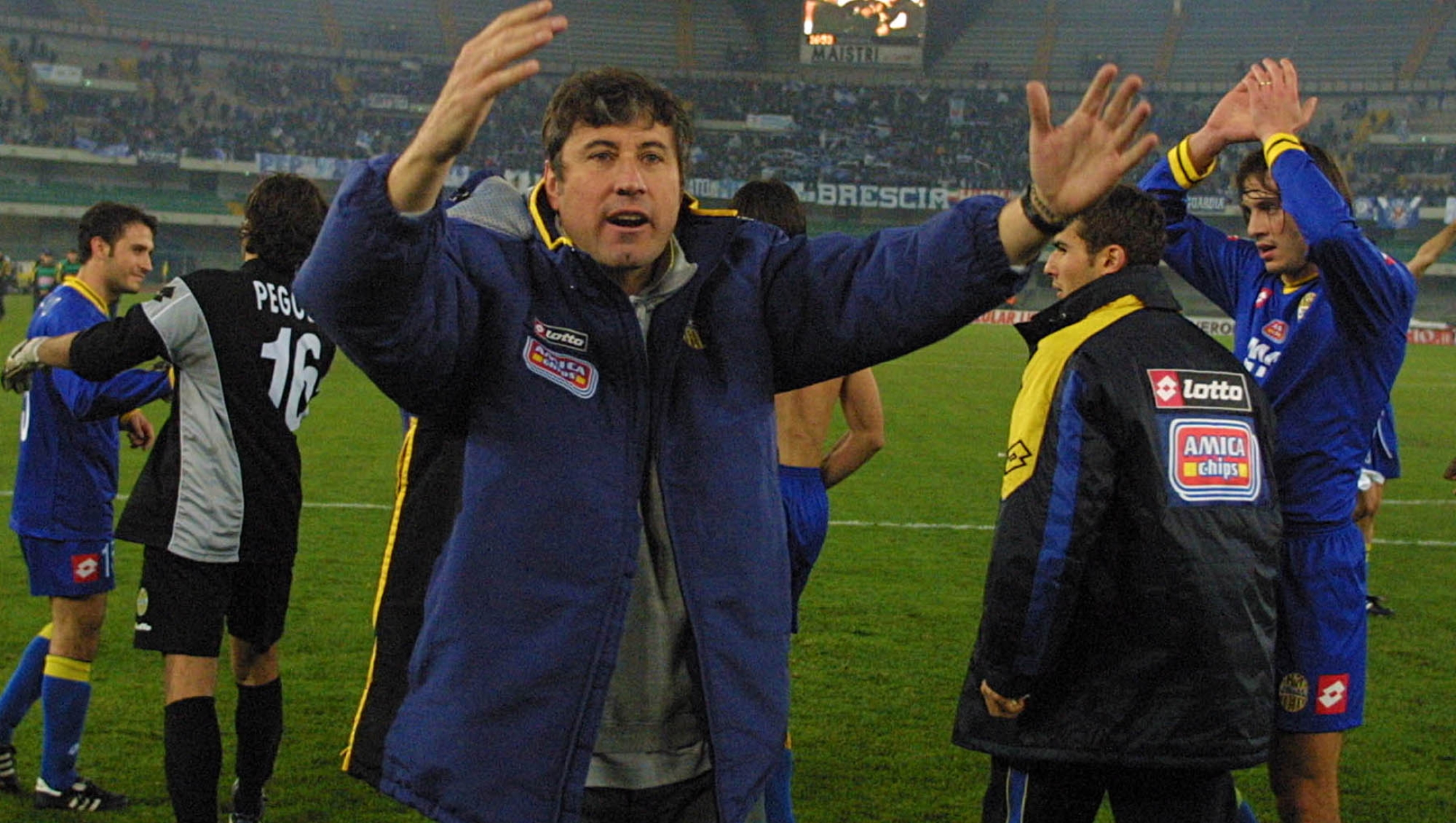 Verona coach Alberto Malesani celebrates as he walks off  the pitch at the end of the Italian first division match between Verona and Brescia at the Verona stadium Sunday, Dec. 2, 2001. Verona won 2-0. (AP Photo/Francesco Dalla Pozza)