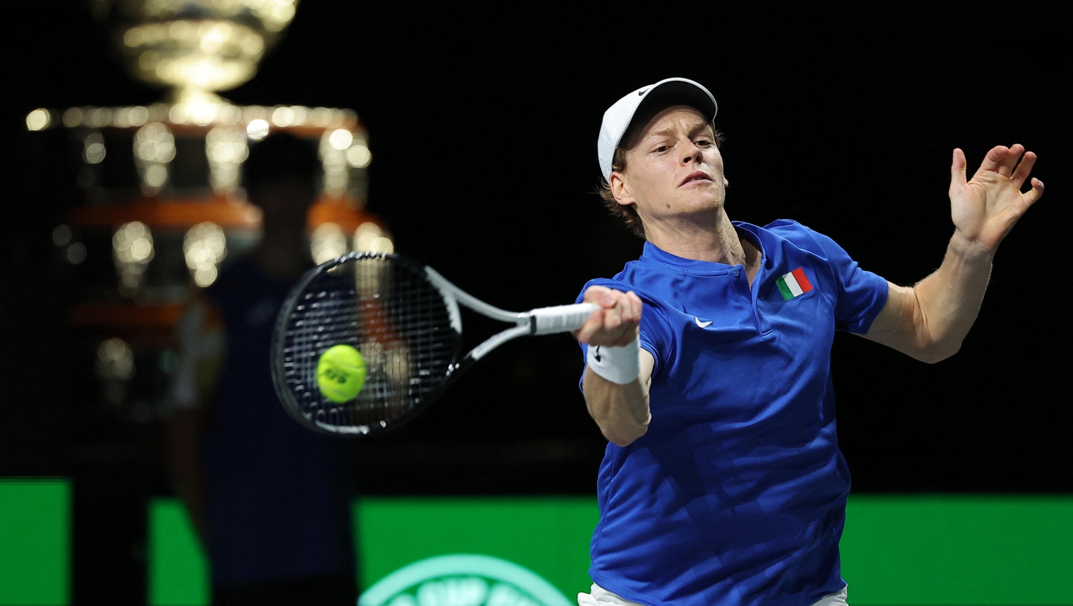 Italy's Jannik Sinner returns the ball against Australia's Alex de Minaur during the second men's singles final tennis match between Australia and Italy of the Davis Cup tennis tournament at the Martin Carpena sportshall, in Malaga on November 26, 2023. (Photo by LLUIS GENE / AFP)