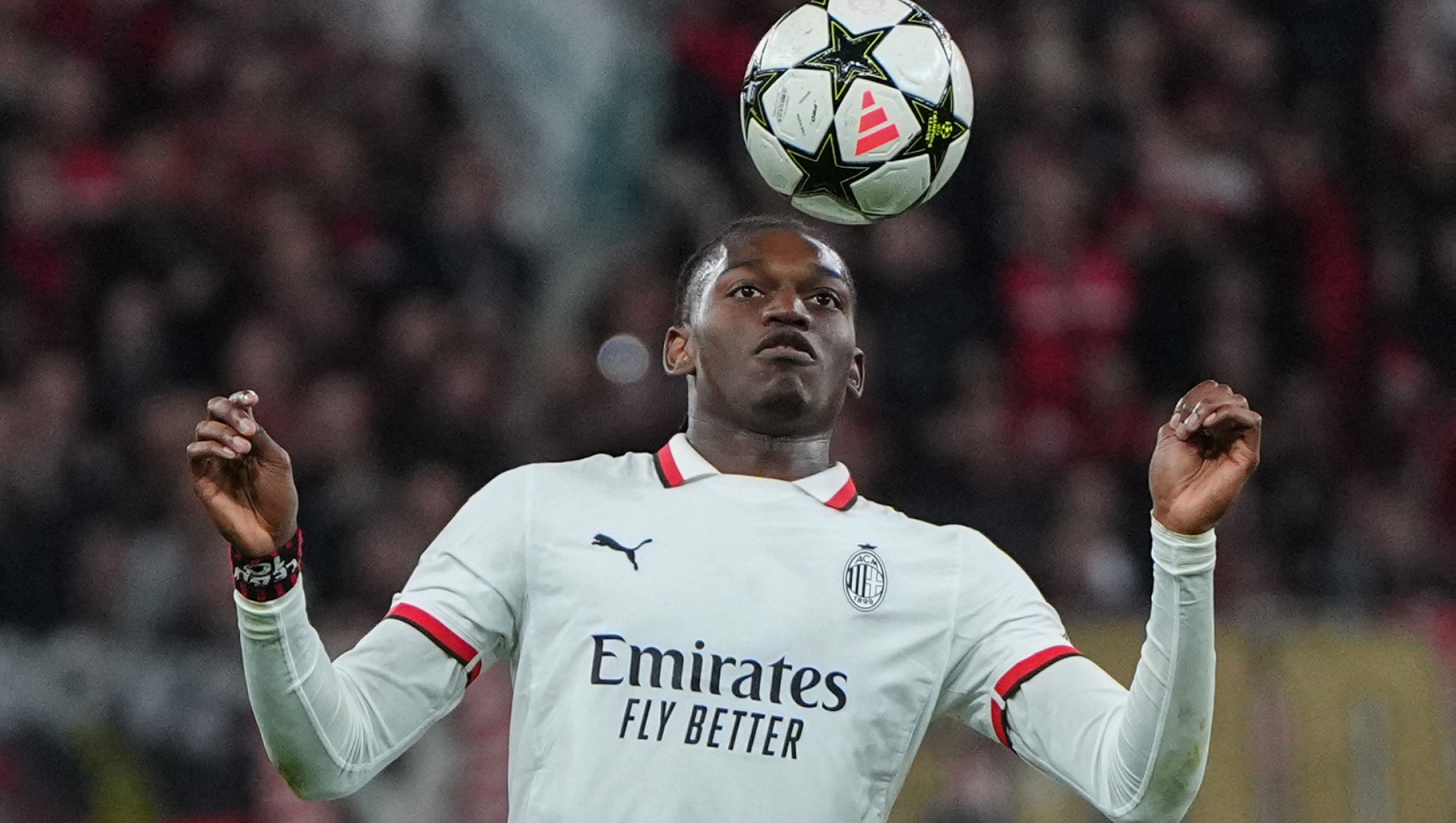 TOPSHOT - AC Milan's Portuguese forward #10 Rafael Leao controls the ball during the UEFA Champions League football match between Bayer 04 Leverkusen and AC Milan in Leverkusen, western Germany on October 1, 2024. (Photo by Pau BARRENA / AFP) / ALTERNATIVE CROP