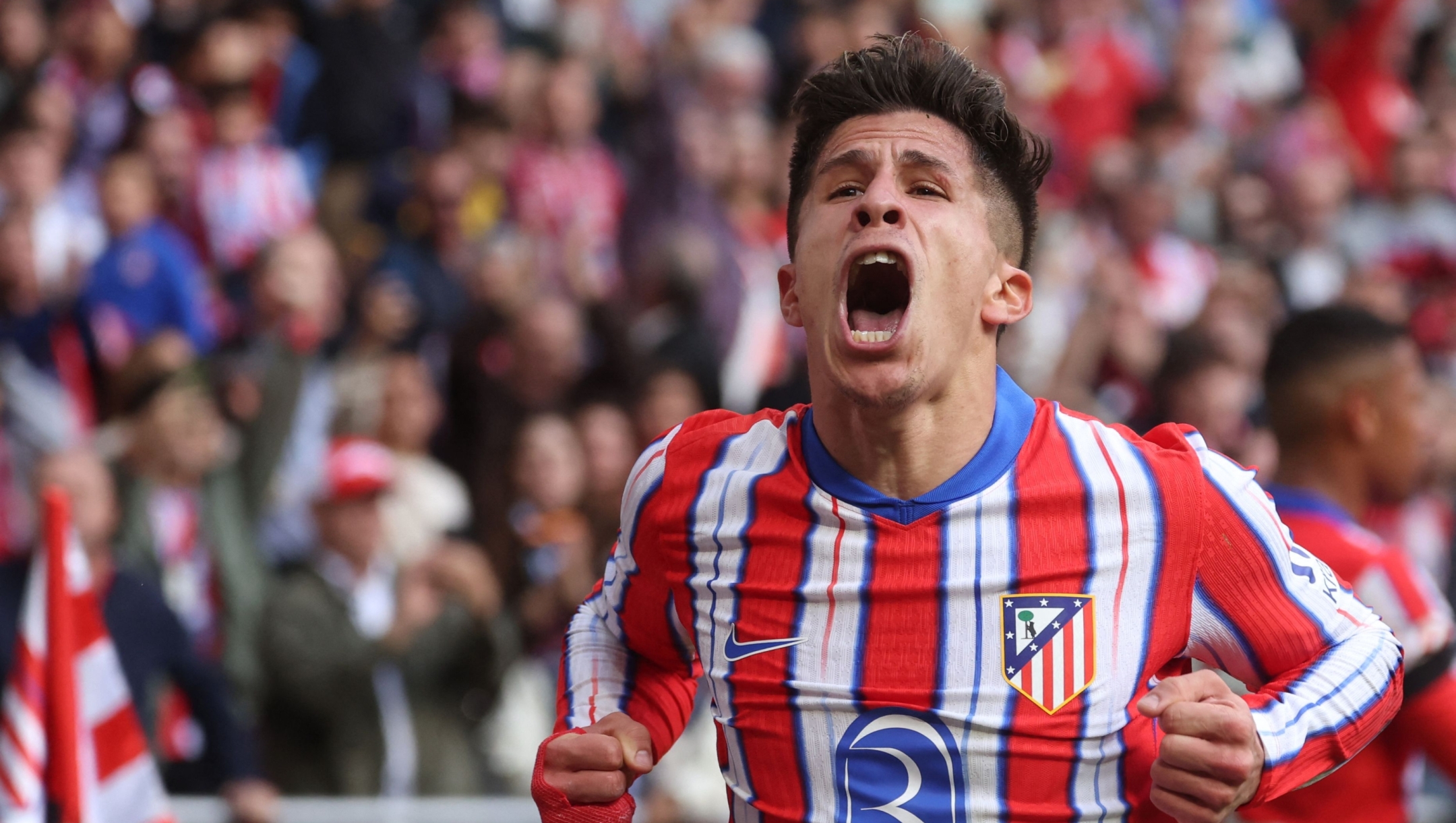 TOPSHOT - Atletico Madrid's Argentine forward #22 Giuliano Simeone celebrates scoring the opening goal during the Spanish league football match between Club Atletico de Madrid and UD Las Palmas at the Metropolitano stadium in Madrid, on November 3, 2024. (Photo by Pierre-Philippe MARCOU / AFP)