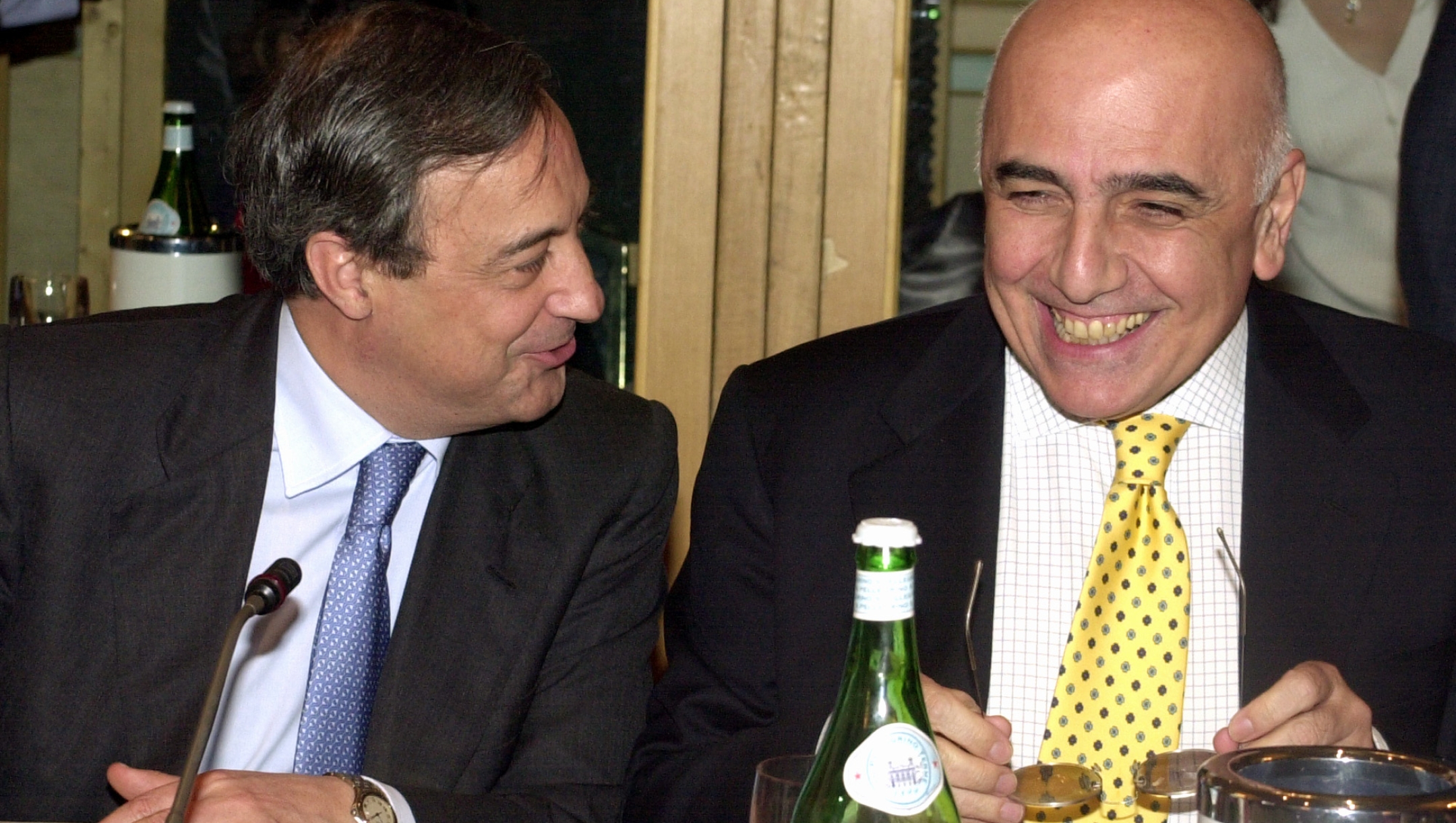 Florentino Perez of Real Madrid, left, talks to AC Milan's Adriano Galliani during the G-14 soccer clubs general assembly meeting in Milan, Italy, Tuesday, May 22, 2001. (AP Photo/Antonio Calanni)