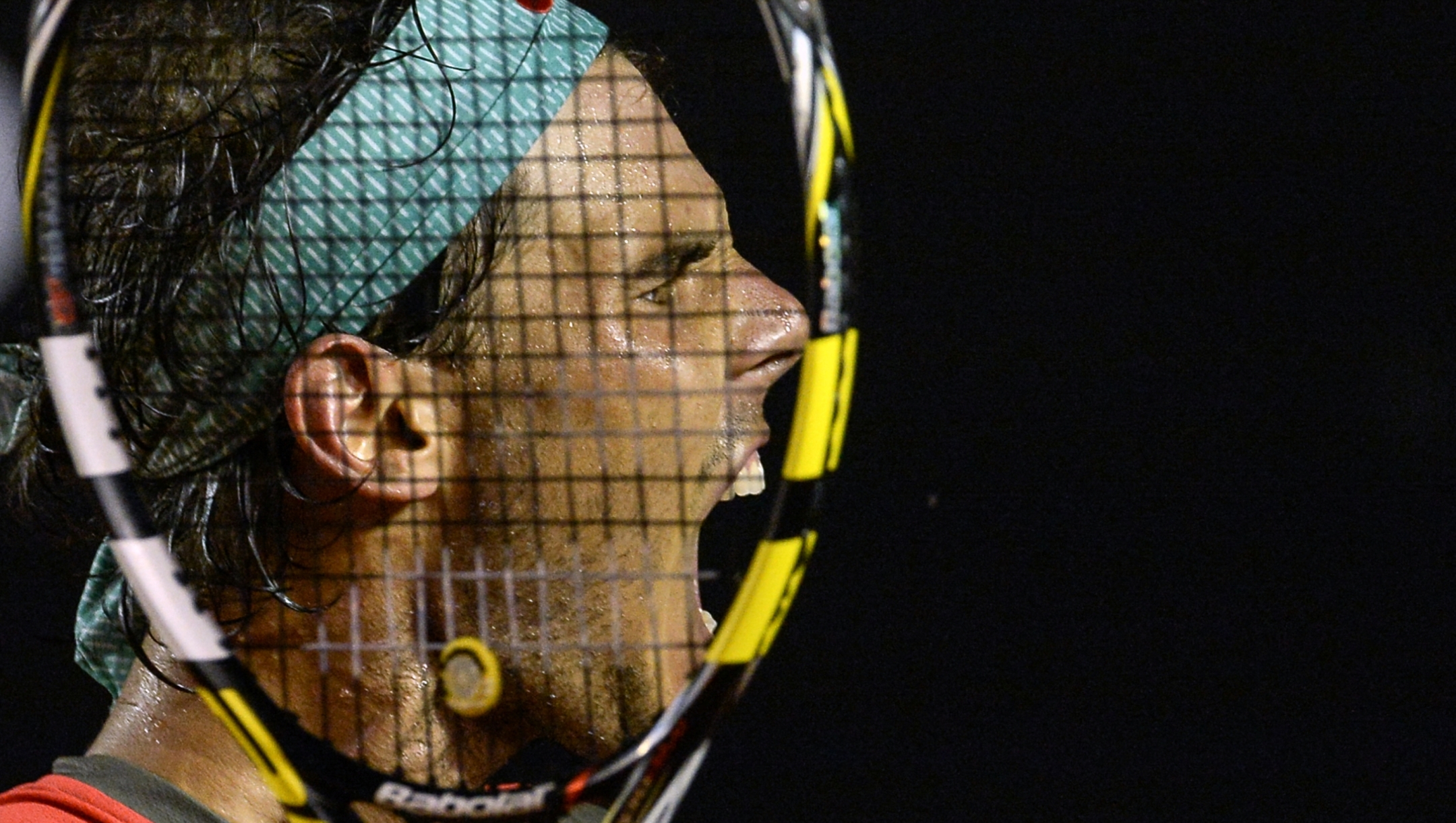 Rafael Nadal of Spain celebrates after winning the 2014 Rio Open men's semi-final singles tennis match against Pablo Andujar of Spain by a tie-break (12-10) in Rio de Janeiro, Brazil, on February 22, 2014. AFP PHOTO / YASUYOSHI CHIBA (Photo by Yasuyoshi CHIBA / AFP)