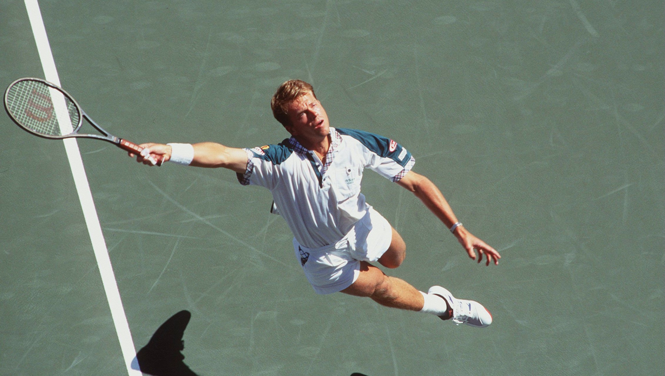 30 AUG 1994:  STEFAN EDBERG REACHES FOR THE LOB IN HIS FIRST ROUND MATCH AGAINST LARS JONSSON  AT THE US OPEN IN FLUSHING MEADOW, NEW YORK.   Mandatory Credit: CLIVE BRUNSKILL/ALLSPORT