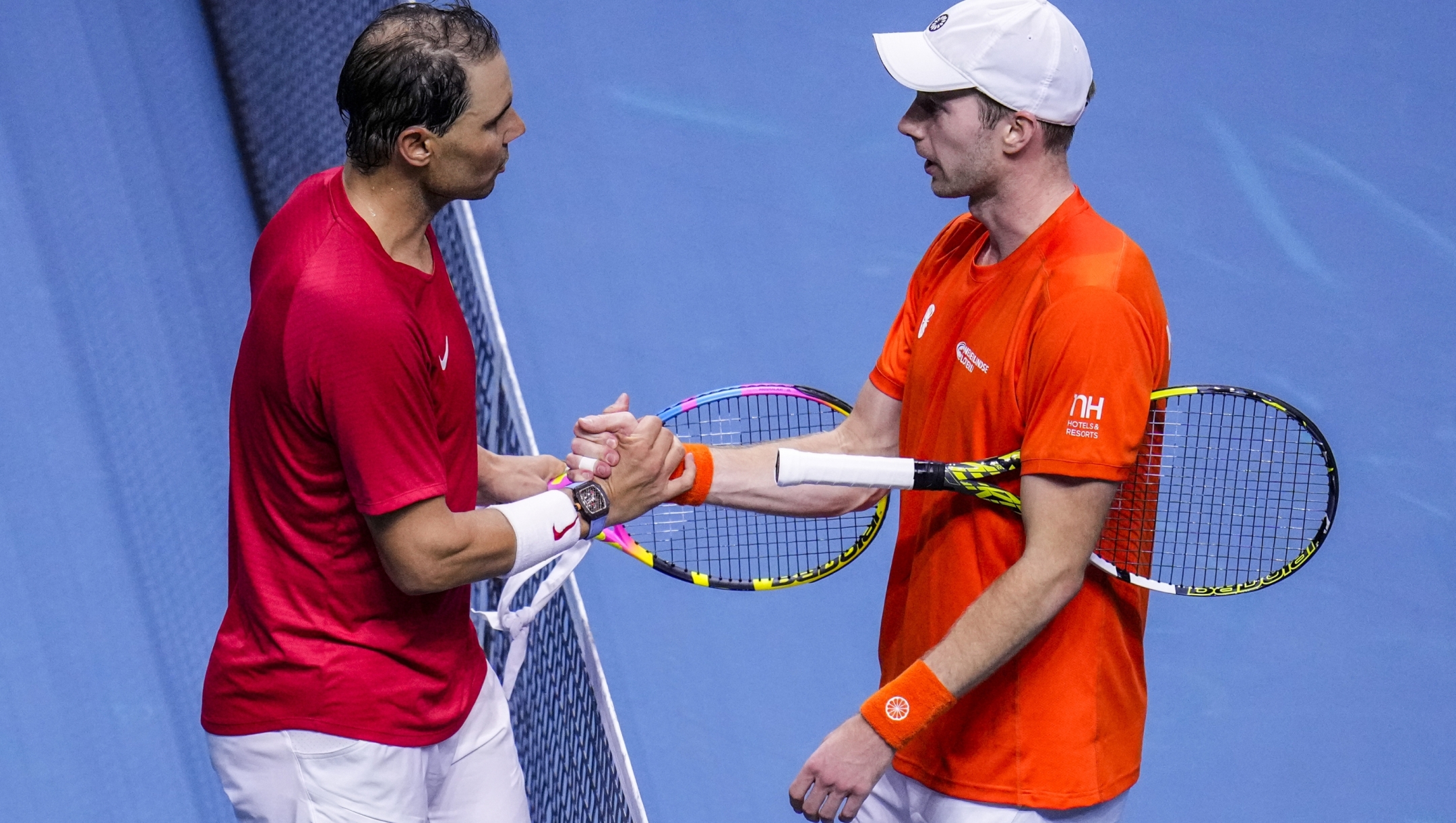 Spain's tennis player Rafael Nadal shakes hands with Netherlands' Botic Van De Zandschulp during a Davis Cup quarterfinal match at Martin Carpena Sports Hall in Malaga, southern Spain, on Tuesday, Nov. 19, 2024. (AP Photo/Manu Fernandez)