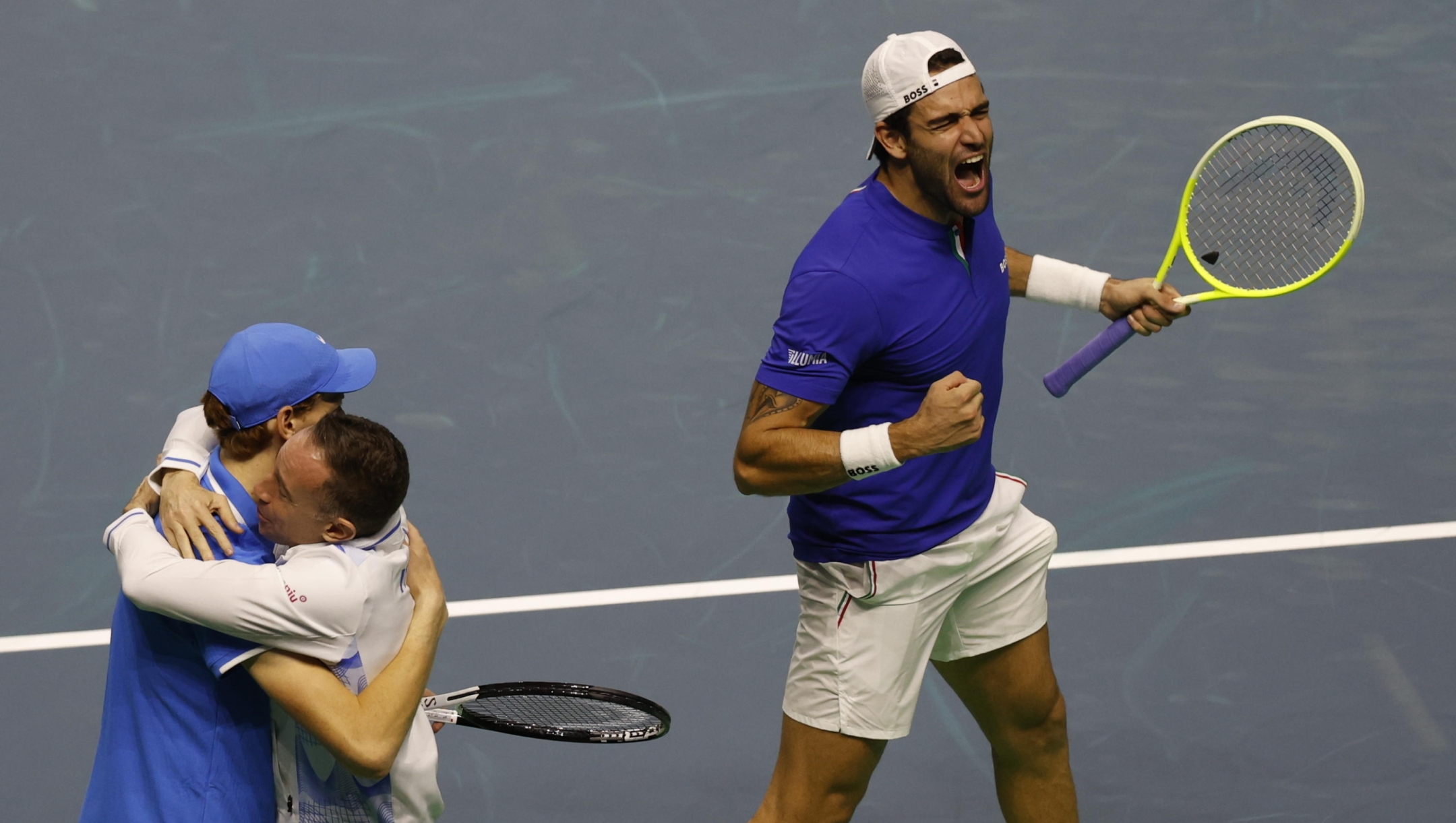 epa11733833 Italian tennis players Matteo Berrettini (R) and Jannick Sinner (L) celebrate with captain Filippo Volandri (C) the victory against Argentinians Maximo Gonzalez and Andres Molteni at the end of the Davis Cup quarterfinals tie between Argentina and Italy played at Jose Maria Martin Carpena arena in Malaga, Spain, 21 November 2024.  EPA/Jorge Zapata