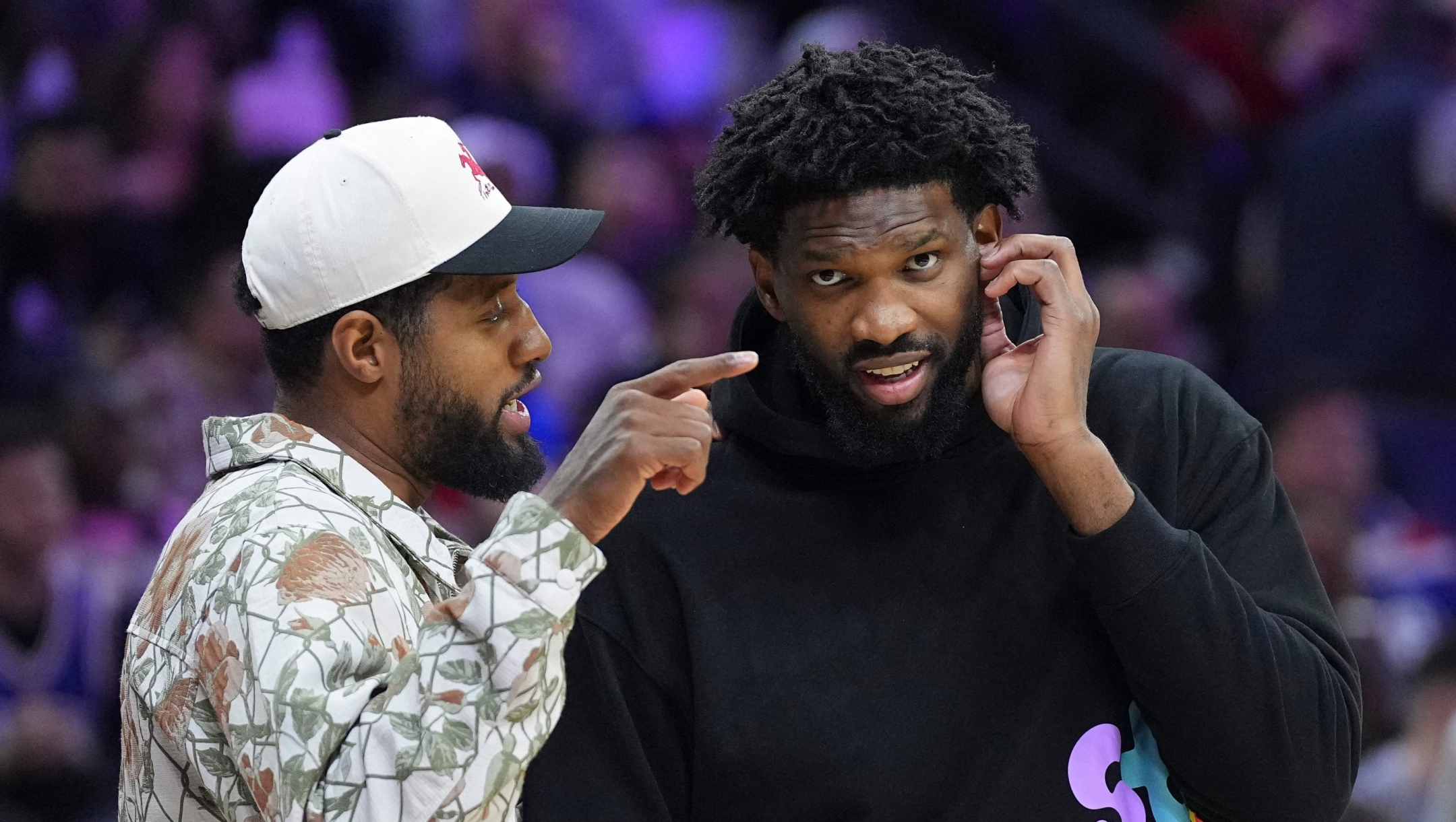 PHILADELPHIA, PENNSYLVANIA - NOVEMBER 2: Paul George #8 of the Philadelphia 76ers talks to Joel Embiid #21 during a timeout in the game against the Memphis Grizzlies in the first half at the Wells Fargo Center on November 2, 2024 in Philadelphia, Pennsylvania. NOTE TO USER: User expressly acknowledges and agrees that, by downloading and/or using this photograph, user is consenting to the terms and conditions of the Getty Images License Agreement.   Mitchell Leff/Getty Images/AFP (Photo by Mitchell Leff / GETTY IMAGES NORTH AMERICA / Getty Images via AFP)