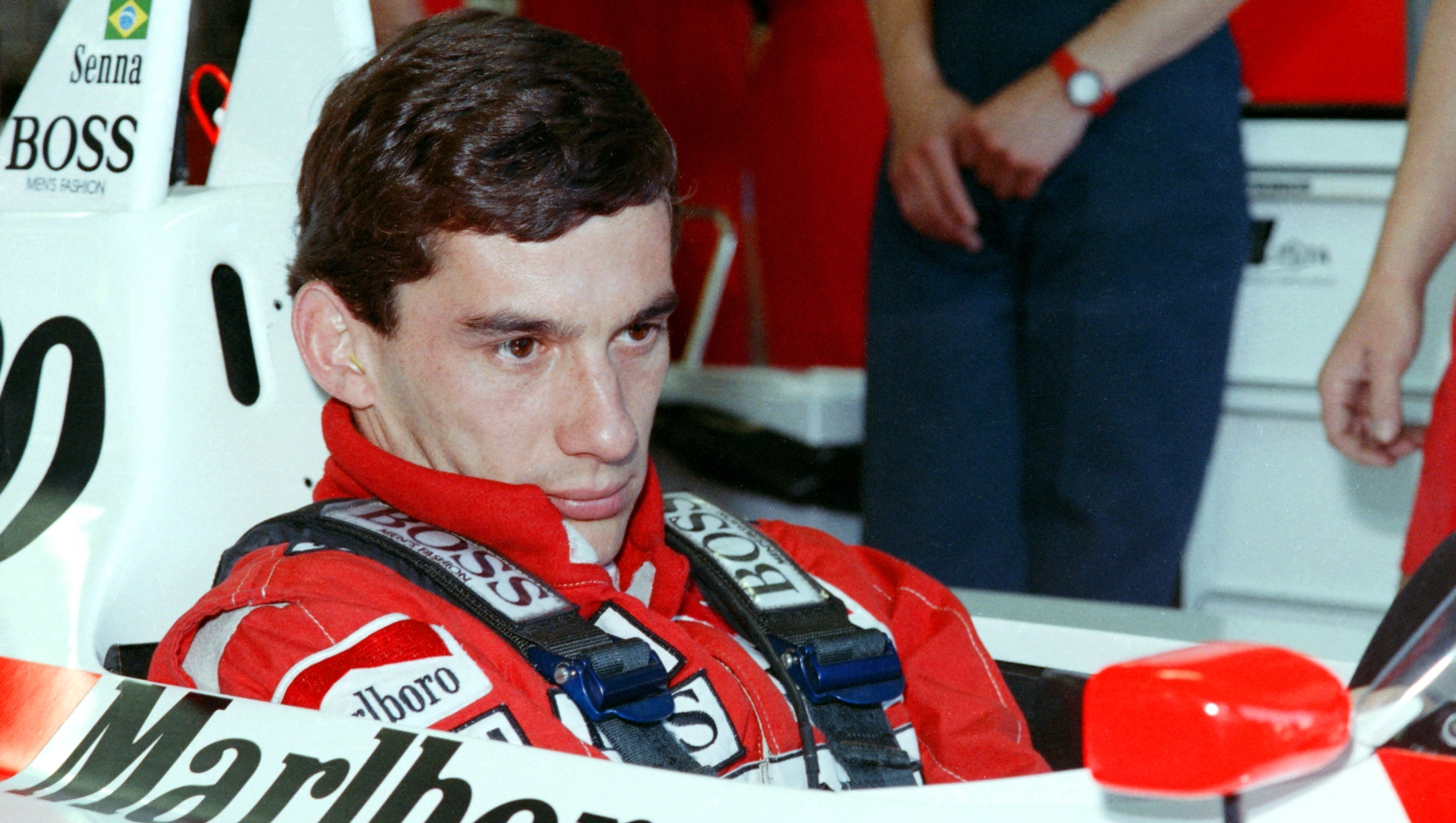 New world champion Ayrton Senna of Brazil concentrates in the pit during the final qualifying for the Australian F1 Grand Prix in Adelaide on November 12, 1988. (Photo by AFP)