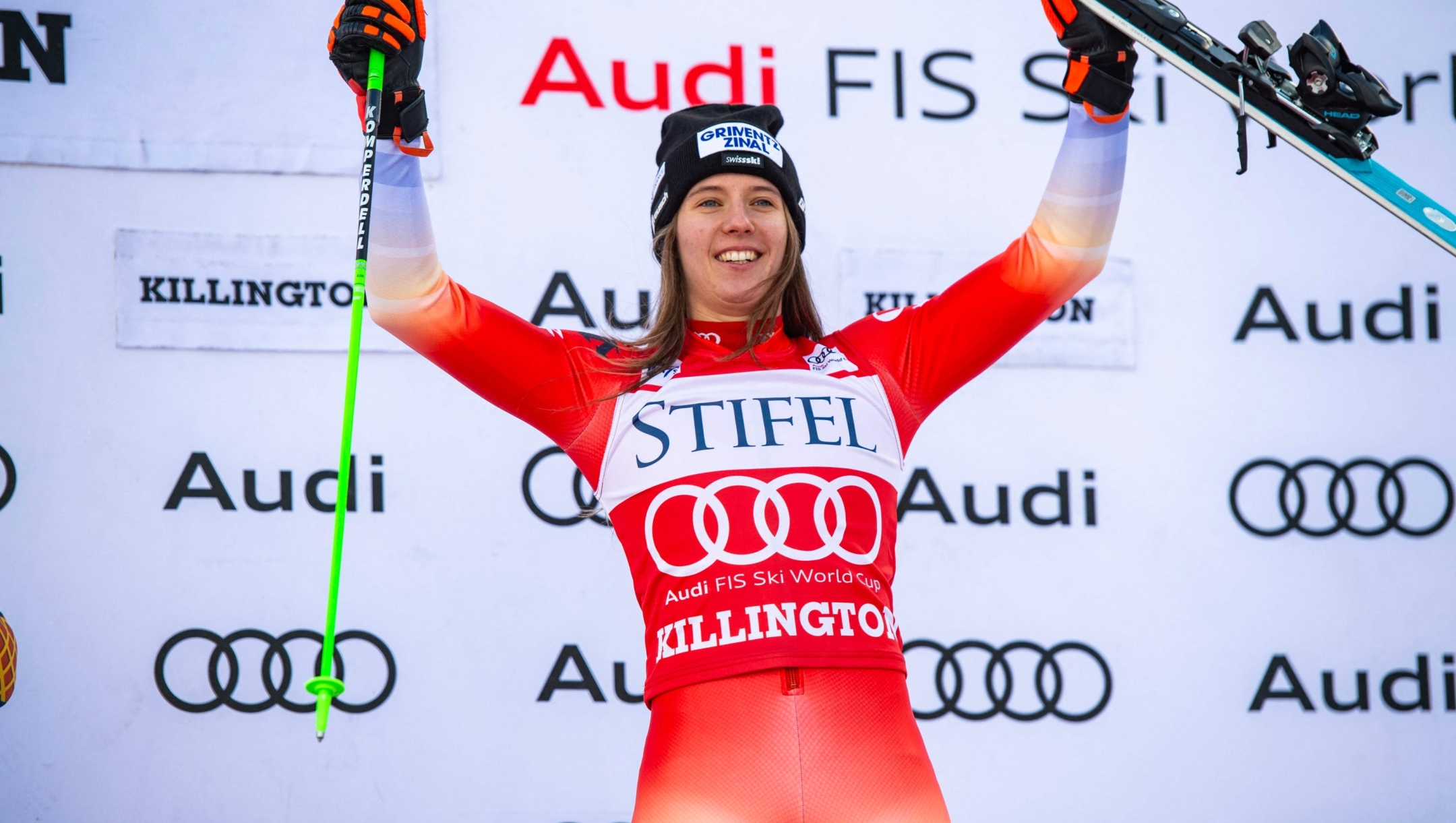 First place winner Camille Rast of Switzerland raises her hands in the air to celebrate during the award ceremony for the second Slalom Run during the 2024/2025 Women's World Cup Giant Slalom in Killington, Vermont, on December 1, 2024. (Photo by Joseph Prezioso / AFP)