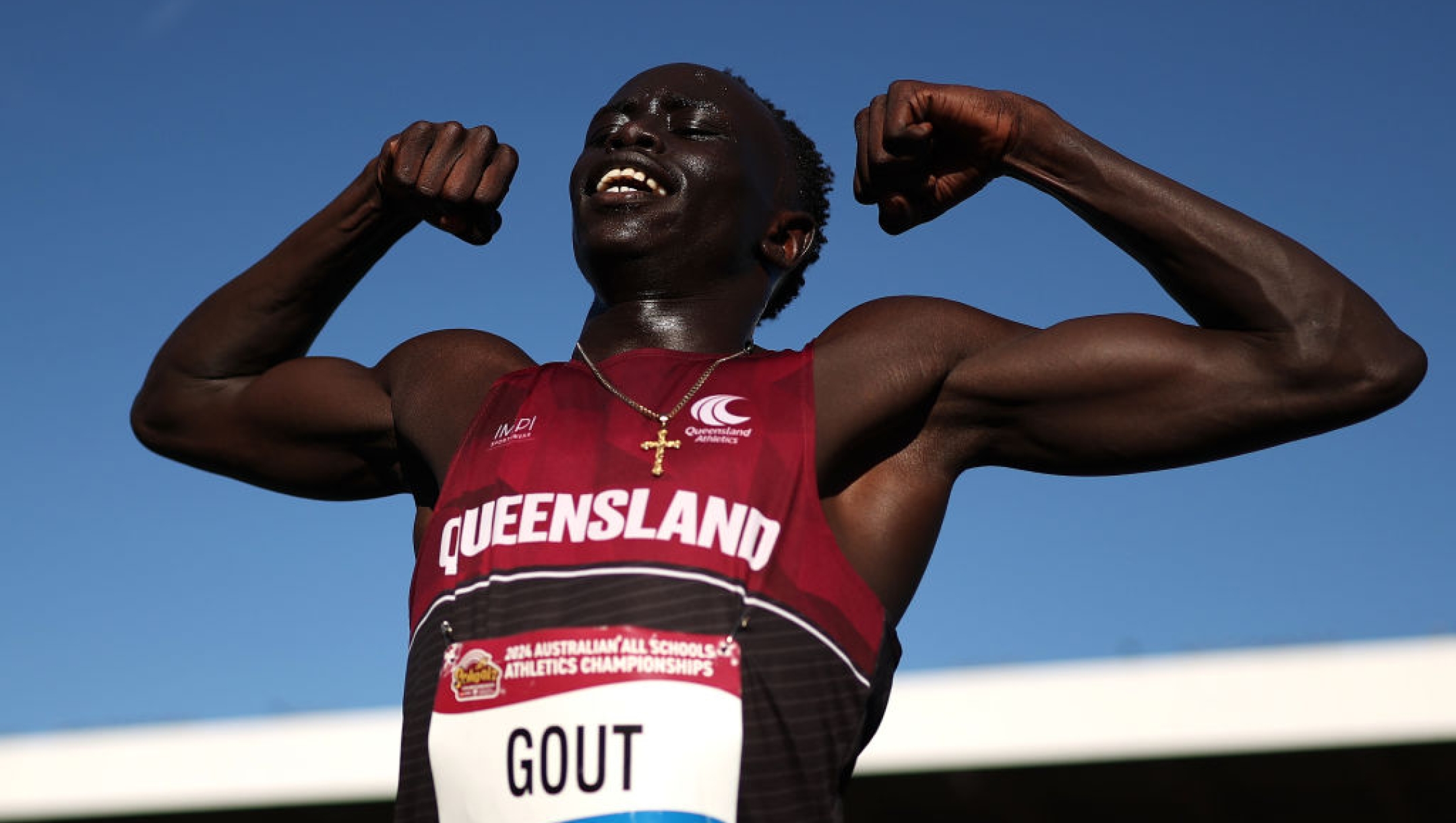 BRISBANE, AUSTRALIA - DECEMBER 07: Gout Gout of Queensland celebrates winning the Boys' U18 200m Final in a new national record time of 20.04 seconds during the 2024 Chemist Warehouse Australian All Schools Athletics Championship at Queensland Sport and Athletics Centre on December 07, 2024 in Brisbane, Australia. (Photo by Cameron Spencer/Getty Images)