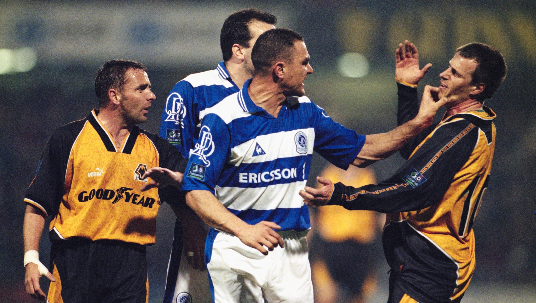 LONDON, UNITED KINGDOM - APRIL 01: QPR player Vinnie Jones (c) gets to grips with Wolves player Steve Claridge as Paul Simpson (l) and Neil Ruddock (obscured) look on during a League Division One match between Queens Park Rangers and Wolverhampton Wanderers at Loftus Road on Aapril 1, 1998 in London, England. (Photo by Alex Livesey/Allsport/Getty Images) *** Local Caption *** Vinnie Jones; Steve Claridge