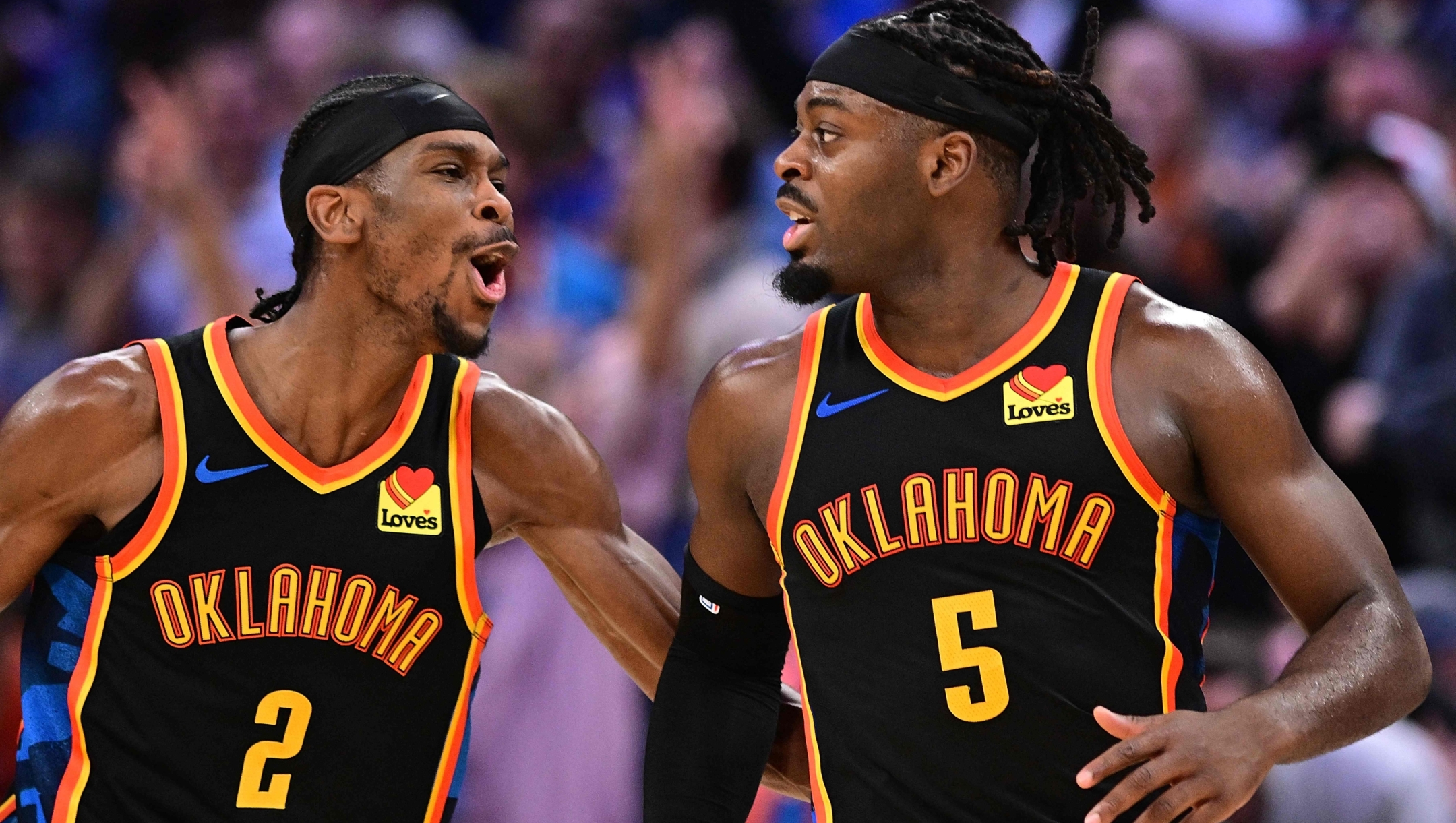 OKLAHOMA CITY, OKLAHOMA - JANUARY 5: Shai Gilgeous-Alexander #2 and Luguentz Dort #5 of the Oklahoma City Thunder celebrate during the second half against the Boston Celtics at Paycom Center on January 5, 2025 in Oklahoma City, Oklahoma. NOTE TO USER: User expressly acknowledges and agrees that, by downloading and or using this photograph, User is consenting to the terms and conditions of the Getty Images License Agreement.   Joshua Gateley/Getty Images/AFP (Photo by Joshua Gateley / GETTY IMAGES NORTH AMERICA / Getty Images via AFP)