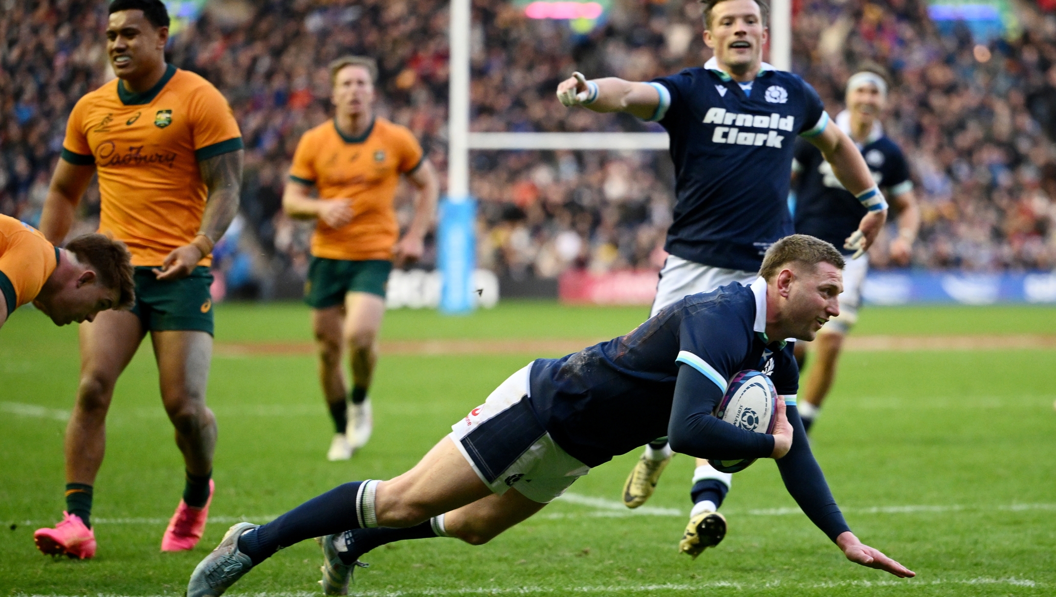 EDINBURGH, SCOTLAND - NOVEMBER 24: Finn Russell of Scotland dives in to score his team's fourth try during the Autumn Nations Series 2024 match between Scotland and Australia at Scottish Gas Murrayfield on November 24, 2024 in Edinburgh, Scotland. (Photo by Stu Forster/Getty Images)