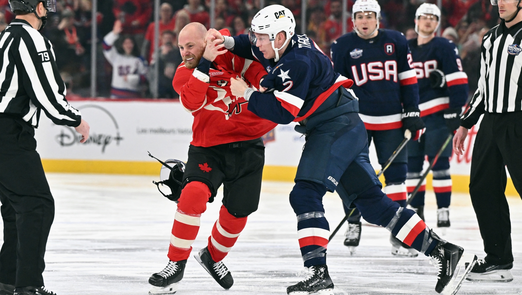 MONTREAL, CANADA - FEBRUARY 15: Brady Tkachuk #7 of Team USA and Sam Bennett #9 of Team Canada fight during the first period in the 4 Nations Face-Off game at the Bell Centre on February 15, 2025 in Montreal, Quebec, Canada.   Minas Panagiotakis/Getty Images/AFP (Photo by Minas Panagiotakis / GETTY IMAGES NORTH AMERICA / Getty Images via AFP)