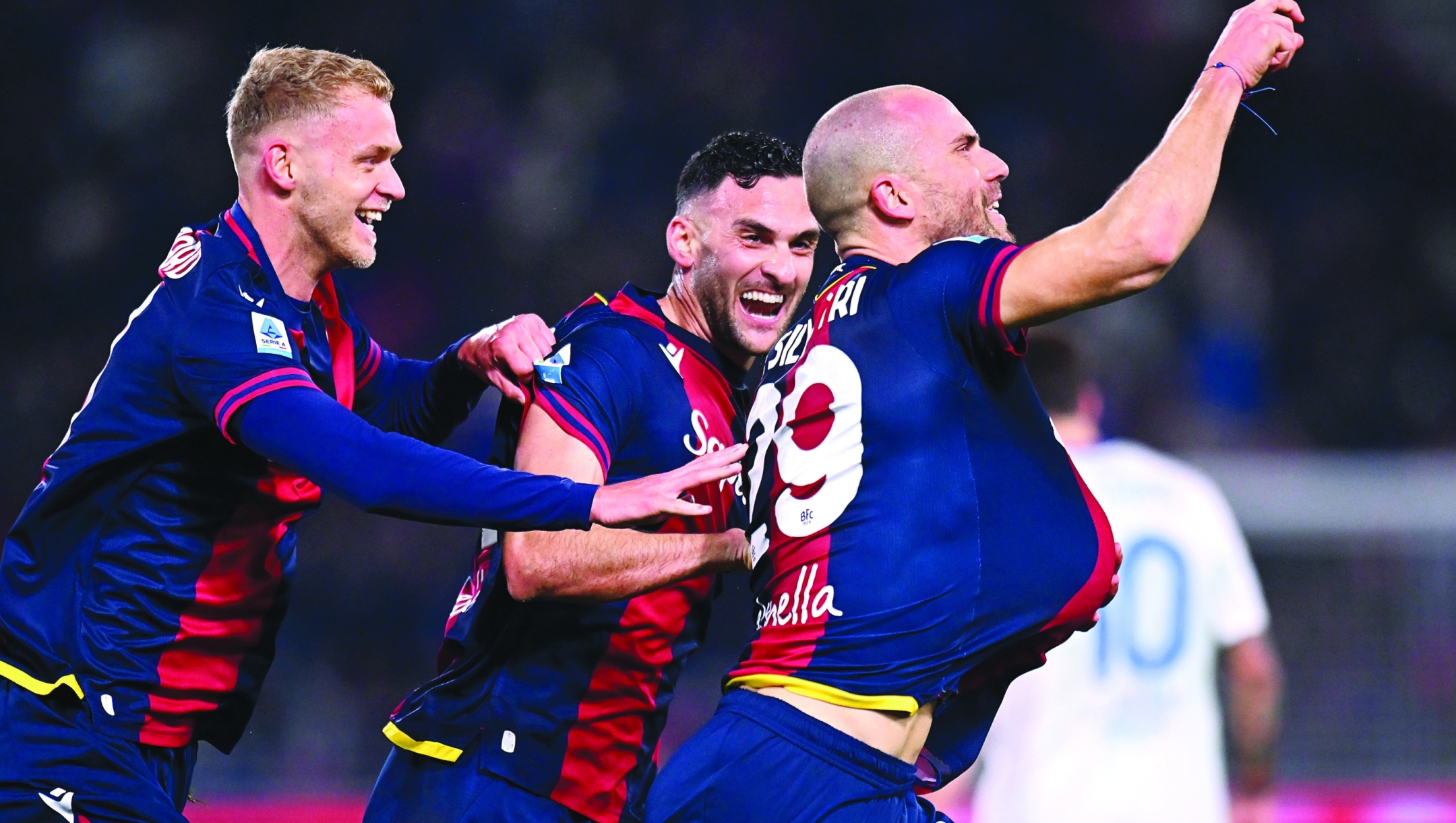 BOLOGNA, ITALY - FEBRUARY 01: Lorenzo De Silvestri of Bologna celebrates scoring his team's first goal with teammates Jens Odgaard and Charalampos Lykogiannis during the Serie A match between Bologna and Como at Stadio Renato Dall'Ara on February 01, 2025 in Bologna, Italy. (Photo by Alessandro Sabattini/Getty Images)