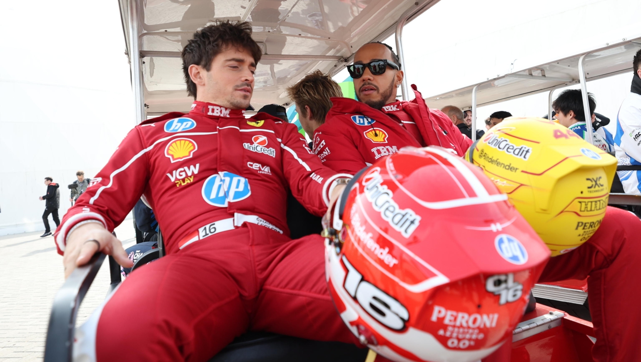 epaselect epa11924901 Scuderia Ferrari drivers Charles Leclerc of Monaco (L) and Lewis Hamilton of Britain leave after a group photo session ahead of the Formula 1 pre-season testing at Bahrain International Circuit in Sakhir, Bahrain, 26 February 2025.  EPA/ALI HAIDER