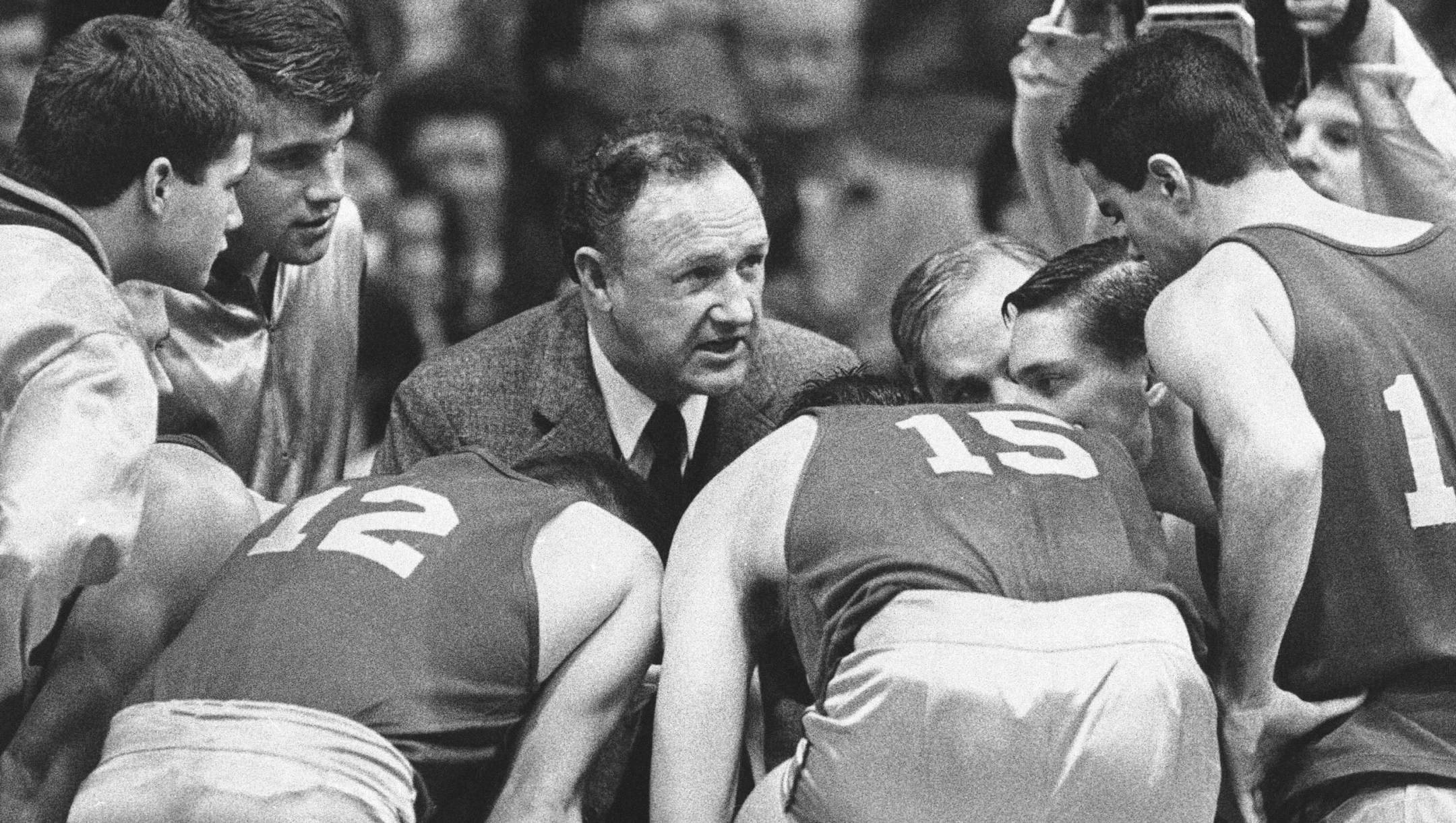 FILE - Actor Gene Hackman gives fictional Hickory High basketball players instructions during filming of the final game of the movie "Hoosiers" at Hinkle Fieldhouse on the Butler University campus, Friday, Dec. 6, 1985 in Indianapolis. (AP Photo/Tom Strickland, File)