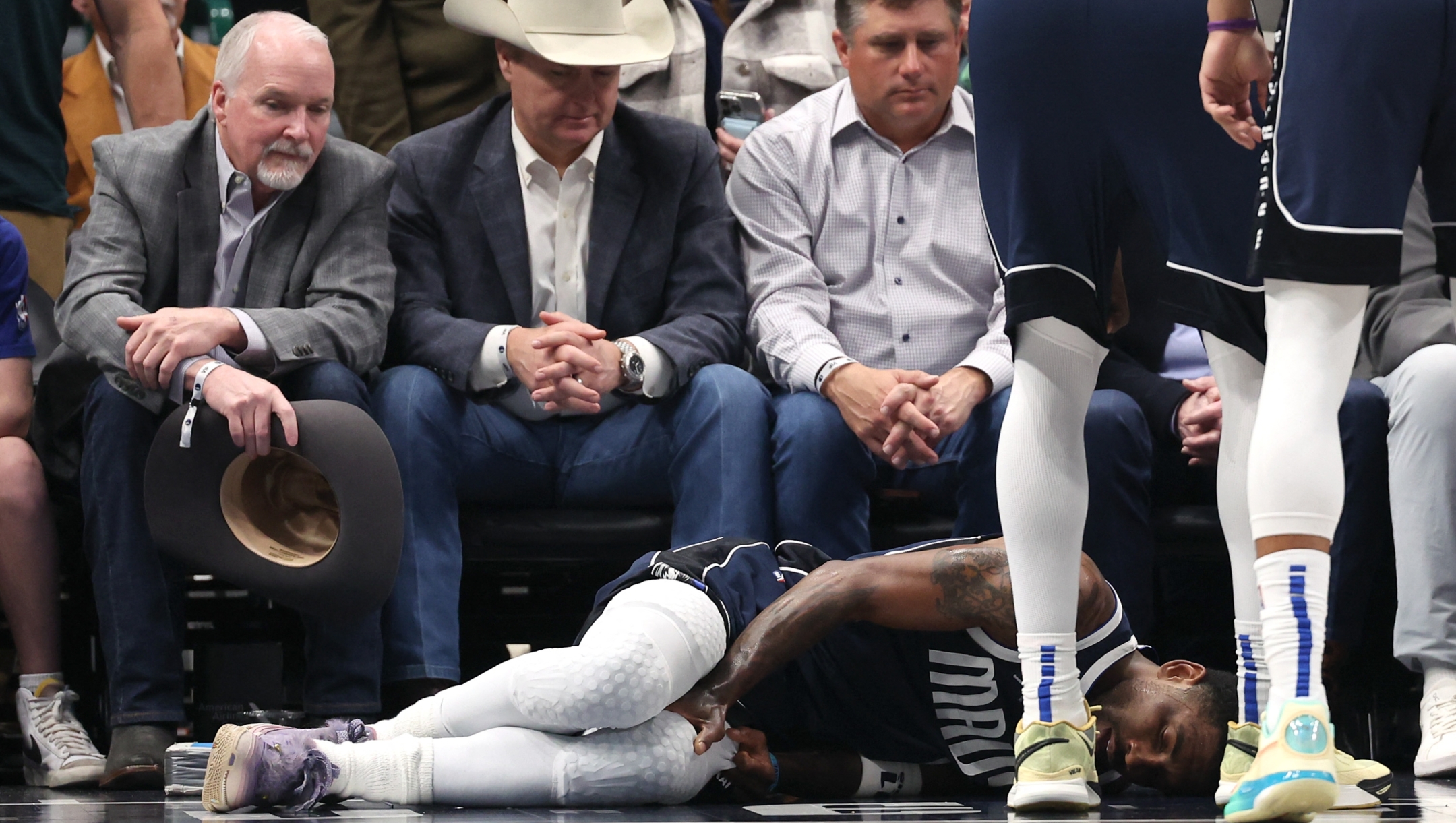 DALLAS, TEXAS - MARCH 03: Kyrie Irving #11 of the Dallas Mavericks lies on the court after suffering an injury in the first half against the Sacramento Kings at American Airlines Center on March 03, 2025 in Dallas, Texas. NOTE TO USER: User expressly acknowledges and agrees that, by downloading and/or using this photograph, user is consenting to the terms and conditions of the Getty Images License Agreement.   Sam Hodde/Getty Images/AFP (Photo by Sam Hodde / GETTY IMAGES NORTH AMERICA / Getty Images via AFP)