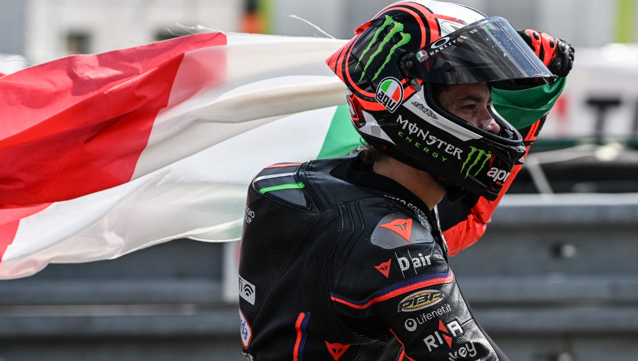 Second placed Aprilia Racing team's Italian MotoGP rider Marco Bezzecchi celebrates after winning the motorcycle Czech Moto GP GRand Prix at the Masaryk circuit in Brno, Czech Republic on July 20, 2025. (Photo by Michal Cizek / AFP)