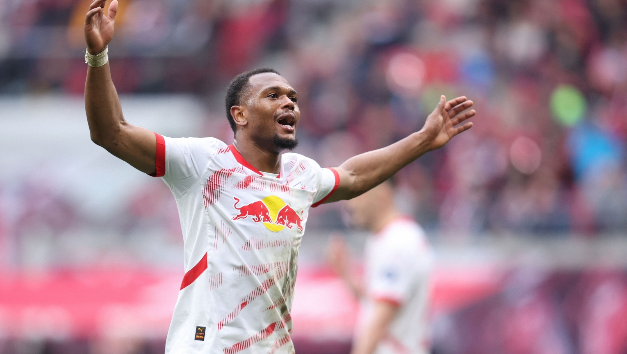 Leipzig's Belgian forward #11 Lois Openda reacts during the German first division Bundesliga football match between RB Leipzig and Holstein Kiel in Leipzig, eastern Germany on April 19, 2025. (Photo by RONNY HARTMANN / AFP) / DFL REGULATIONS PROHIBIT ANY USE OF PHOTOGRAPHS AS IMAGE SEQUENCES AND/OR QUASI-VIDEO
