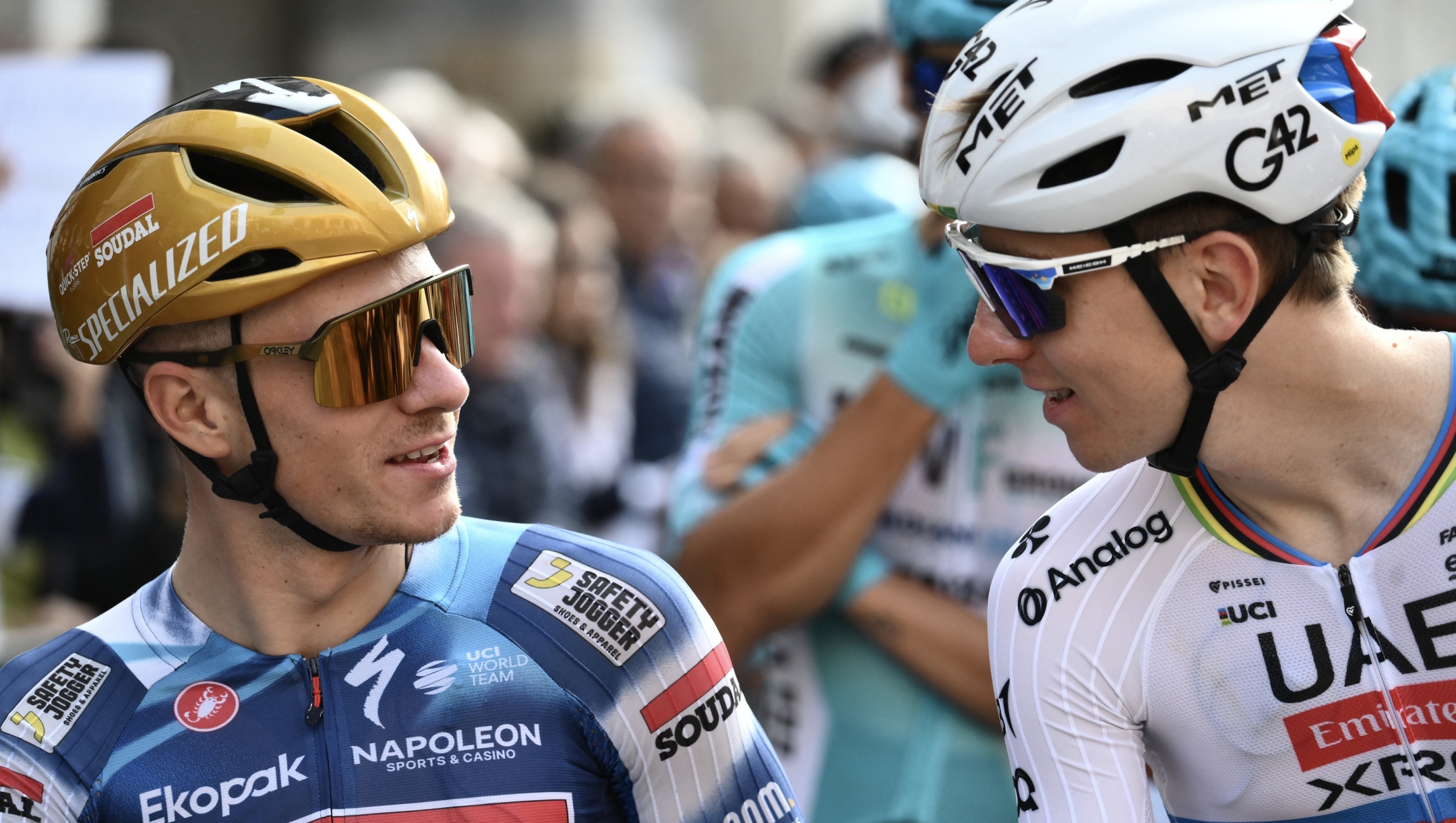 Soudal Quick-Step’s Belgian rider Remco Evenepoel (L) speaks with UAE Team Emirates’s Slovenian rider Tadej Pogacar (R) ahead of the 119th edition of the Giro di Lombardia (Tour of Lombardy), a 238km cycling race from Como to Bergamo on October 11, 2025. (Photo by Marco BERTORELLO / AFP)