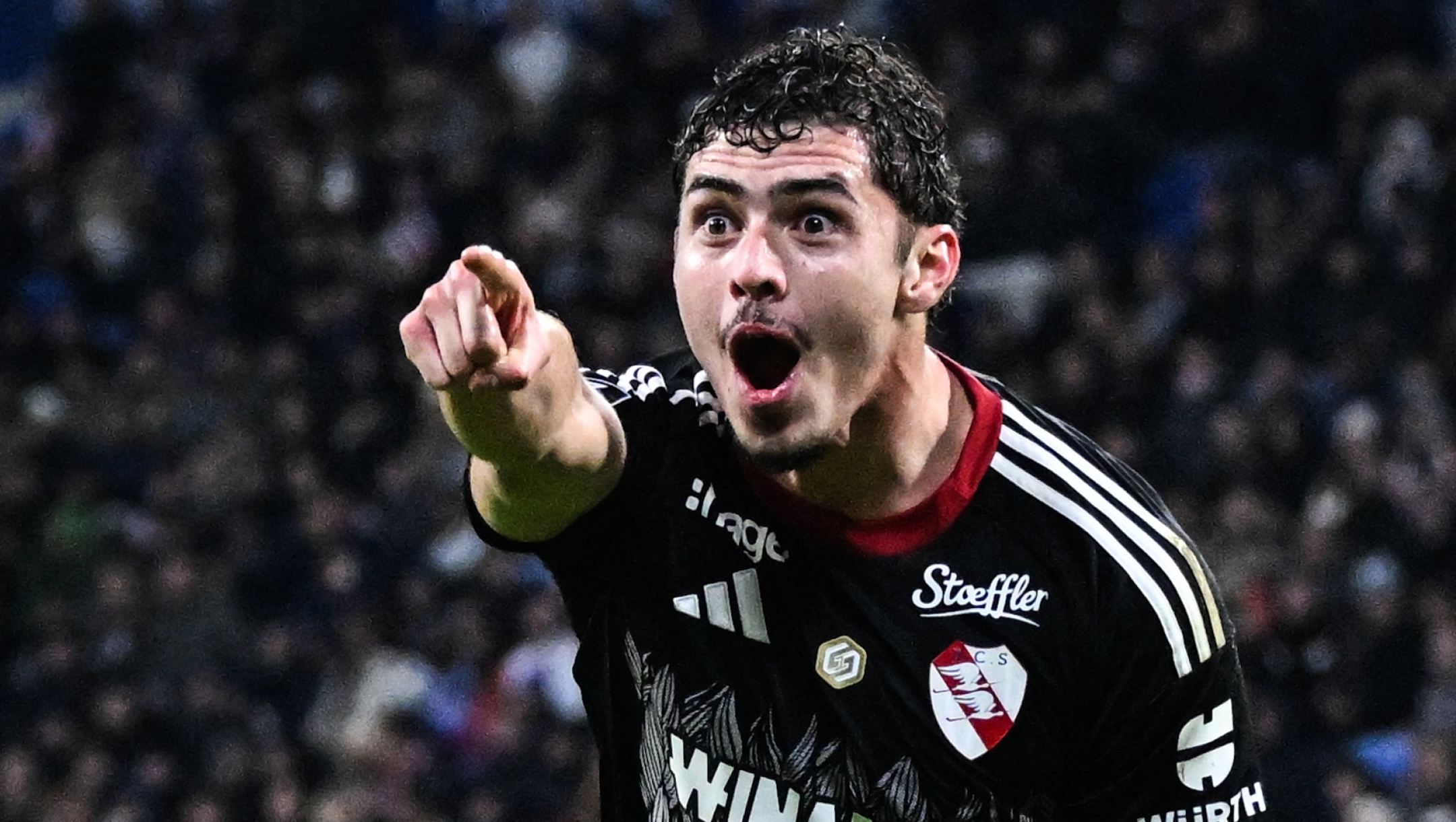 Strasbourg's Argentine forward #09 Joaquin Panichelli celebrates after scoring Strasbourg's first goal during the French L1 football match between Olympique Lyonnais (OL) and RC Strasbourg Alsace at the Parc Olympique Lyonnais stadium in Decines-Charpieu, central-eastern France, on October 26, 2025. (Photo by OLIVIER CHASSIGNOLE / AFP)